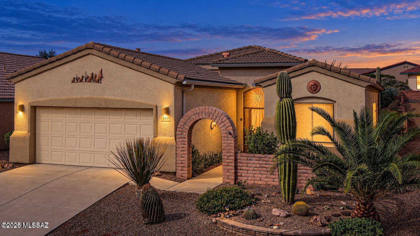 THE UPGRADES YOU WANT & LAS CAMPANAS LIFESTYLE YOU'LL LOVE! Enjoy peace of mind in this beautiful 2-bedroom, 2-bath home with a versatile den, spacious 2-car garage, and 1,584 sq. ft. of inviting living space. Major improvements include a BRAND-NEW HVAC system (2026), 12 NEW WINDOWS (2026), and a termite warranty in place through May 2027. The charming front courtyard welcomes you into a modern, open floor plan designed for easy Arizona living. A beautiful Southwestern mural creates a striking focal point in the great room, adding distinctive character and complementing the tile flooring. The lovely kitchen offers granite countertops, custom-painted cabinetry, a modern subway tile backsplash, gas range, and a generous breakfast bar that opens to the dining area with a bay window. The desirable split-bedroom floor plan offers privacy for both owners and guests. The spacious primary suite features a bay window, a walk-in closet, a second closet for additional storage, and an en-suite bathroom with dual vanities and a walk-in shower. The light-filled guest bedroom is conveniently located next to the full guest bathroom with a tub-and-shower combination.The versatile den can easily become a private office, reading retreat, hobby room, or comfortable TV lounge. The roomy two-car garage offers a clean, polished look with freshly painted flooring (2026), plus the added convenience of a water-softener loop.  Step outside to the low-maintenance backyard and relax or entertain under the covered patio. Located just minutes from Green Valley Recreation, shopping, dining, and convenient access to I-19. GVR offers an impressive variety of amenities and activities, including fitness centers, pools, pickleball courts, classes, movies, shows and much more. This age restricted home (55+) is perfect as year a this home is perfect as a year-round residence, seasonal retreat, or investment property.