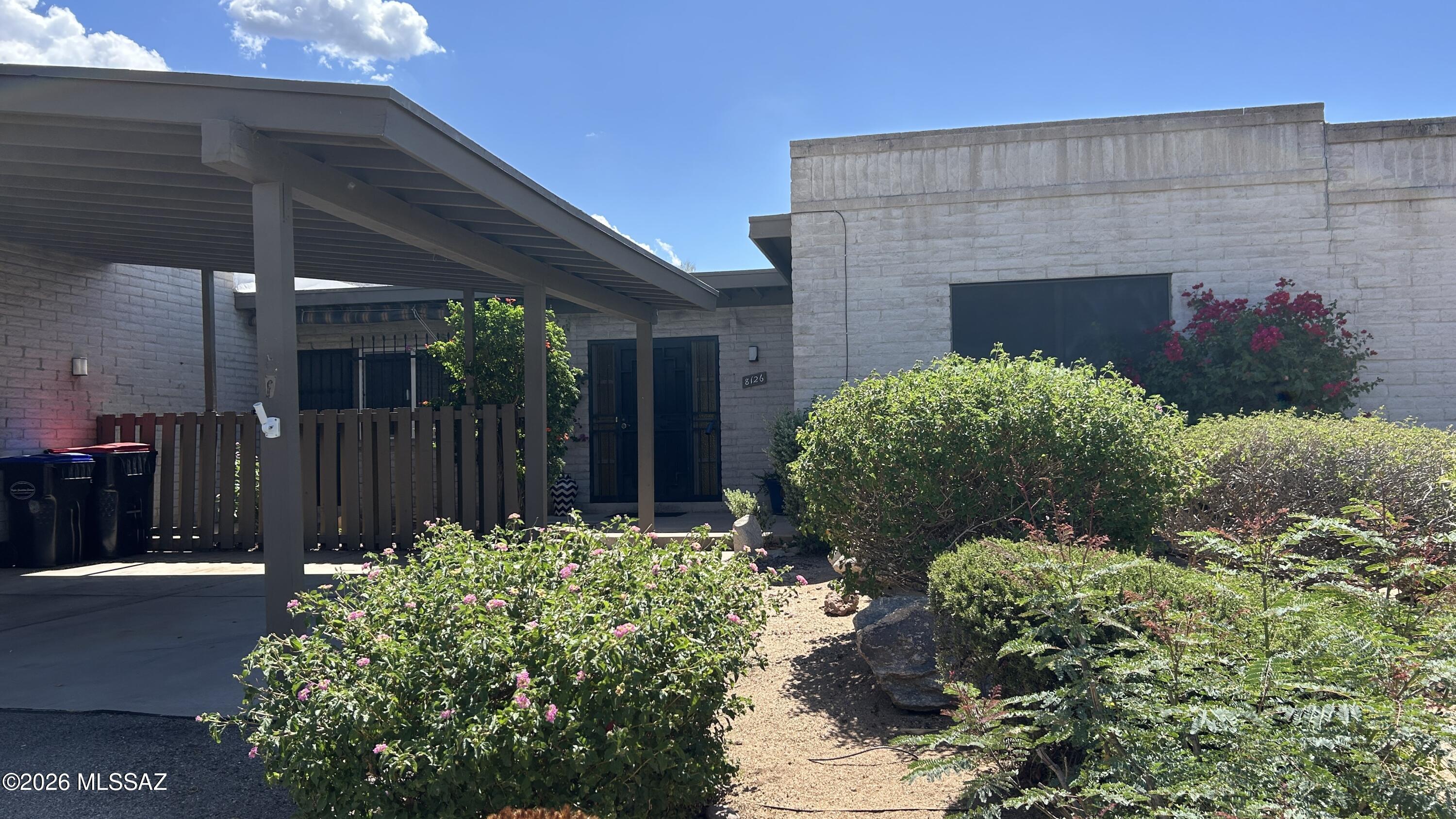 This beautifully appointed 2 BR 2 BA townhome is in move-in condition.  You will enjoy the gleaming wood laminate flooring throughout, with exception of ceramic
tile in baths. Freshly painted and squeaky clean, this home offers newer vinyl windows, tastefully remodeled baths and a 11 x 8 all season porch with a view of sunrises over Pusch Ridge. Access the patio from dining room or primary bedroom, with garden areas for planting and access to walking paths out your back gate. Community pool is steps away. HOA includes water, sewer, exterior front painting, front yard maintenance and common areas, pool and Ramada. This is a quiet community with easy access to shopping, medical facilities, schools and churches.
Open House Sat.&Sun., 5/9 and 5/10 11:00-2:00.