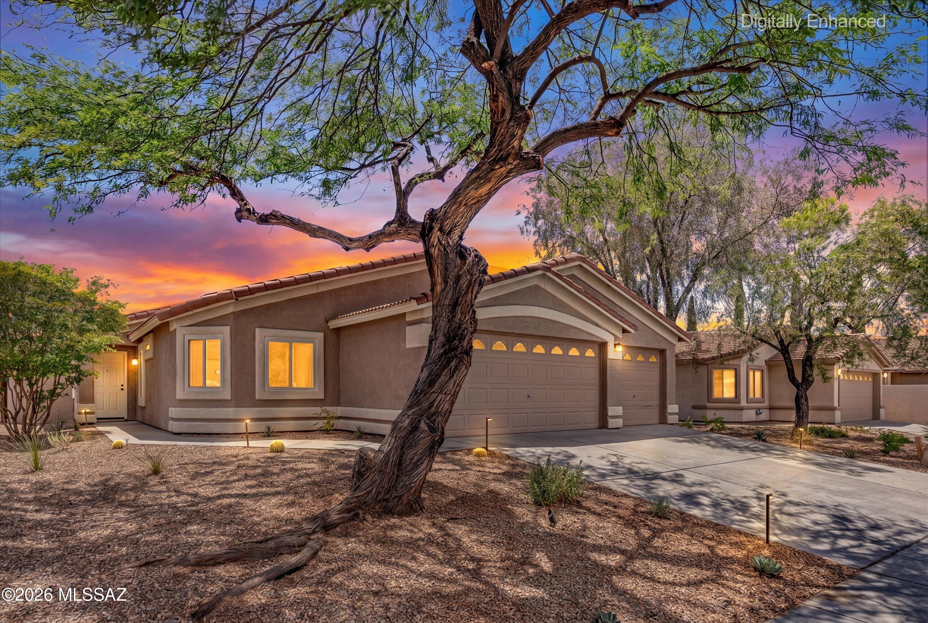 Gorgeous Rancho Vistoso home featuring 4 bedrooms, 2 baths, and a spacious 3 car garage w/charging station for electric vehicles. The split floor plan allows for
privacy and the solar system and newer windows (2025) keep energy costs low. You'll enjoy whipping up a meal in the well appointed kitchen with granite counters, glass backsplash, and newer fridge. Updates include high end laminate flooring, fresh interior paint, tankless water heater and water softener. Fabulous location near Oro Valley Marketplace, Honey Bee Canyon Park, and Oro Valley Hospital. Schedule your showing today!