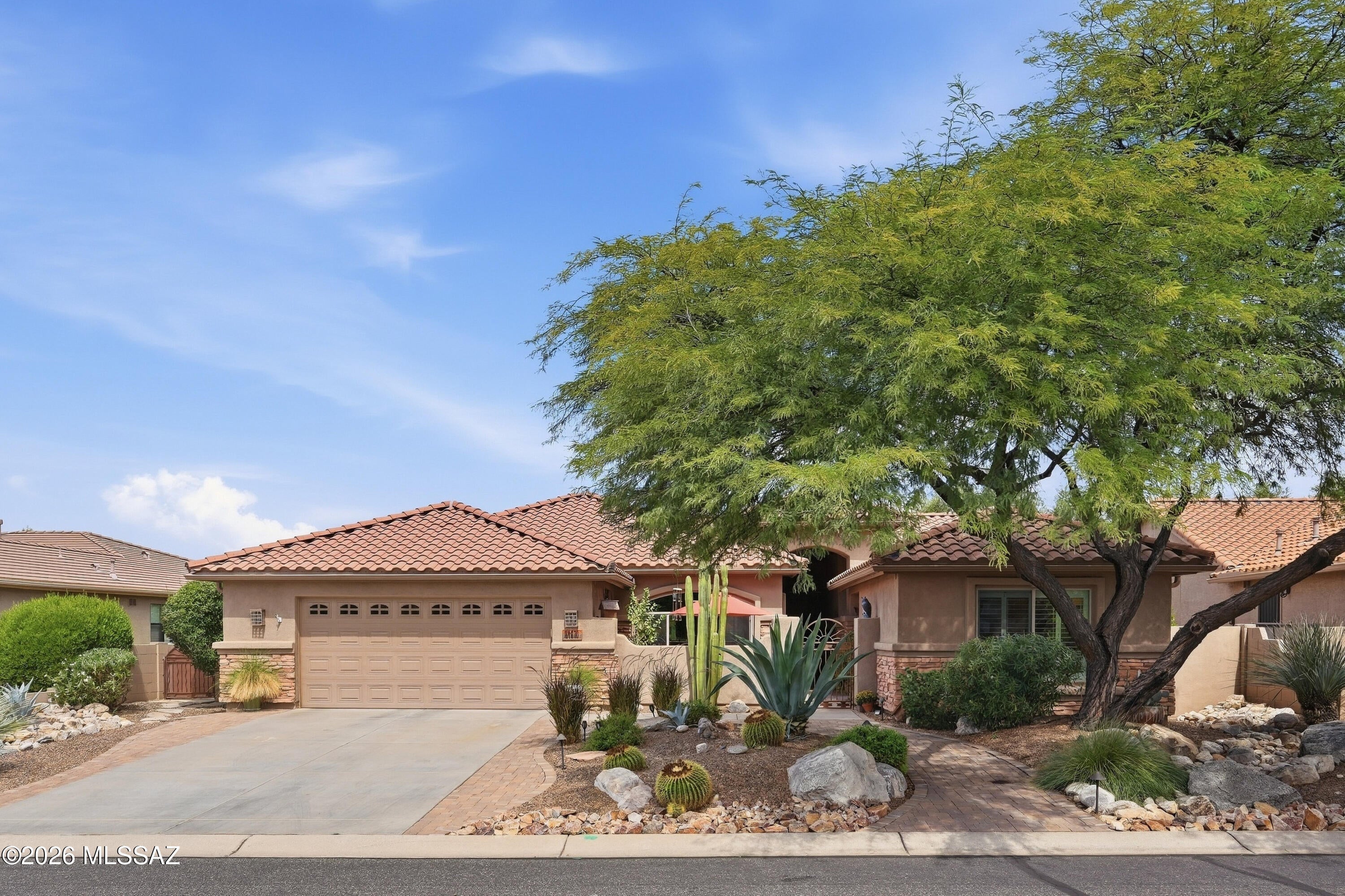 In the entire 5,374-square-mile expanse of Pinal County, there are currently only three active MLS listings featuring a ground-floor casita priced at $625,000 or less. ONLY ONE offers the expanded footprint & entertainment space of a 450+ sq ft screened-in Arizona Room. This is a rare opportunity to capture an extraordinary piece of SaddleBrooke, a premier, resident-owned enclave celebrated for its championship golf, tennis, pickleball, & miles of pristine Sonoran Desert trails. With one of the most coveted & unique floor plans, this platinum-level Laredo model features a ground-floor casita. The 3 bdrms, 3 full baths, plus a den, offer the ideal layout for hosting loved ones as well as enough space to dazzle your envious, cold &  damp Northern friends when they come to visit. A private front courtyard greets you with the soothing sounds of two custom water features, establishing a zen-like ambiance before you even step inside. Once inside, the expansive great room with vaulted ceiling welcomes your guests.  To your left you will find a large bright kitchen and dining area. This exceptional kitchen will bring a smile to the face of the most discerning chef. Because, as you know, more than cooking goes on in the kitchen. This is where you entertain!  Granite counters surround a massive island giving you plenty of space for preparing your next epicurean masterpiece.  If you like to entertain or have pets that enjoy being outside too, you will love the seamless flexibility of using your enormous 450+ sq ft screened-in Arizona Room.  This shaded space also makes for a perfect plant sanctuary if you have a green thumb.  Outside, you will find a collection of fruit trees (Peach, apricot, lemon & pomegranate) as well as a rosemary bush that will keep you well-supplied with sugar and spice.  Just a 'chip shot' away from 63 holes of championship golf.  Located in SaddleBrooke's 'Theatre District' this home offers close proximity to the Desert View Performing Arts Center, a vibrant 480-seat venue for hosting a variety of live entertainment. This active resort-style 55+ retirement lifestyle with over 200 organized resident-led clubs cater to a whole spectrum of hobbies ranging from hiking and photography to silversmithing, and woodworking as well as bridge, poker, and mahjong.  Are you ready to take the first step out of your chilly northern environment and make a commitment to enjoying at least a portion of the year in a warm carefree community? Look no further.