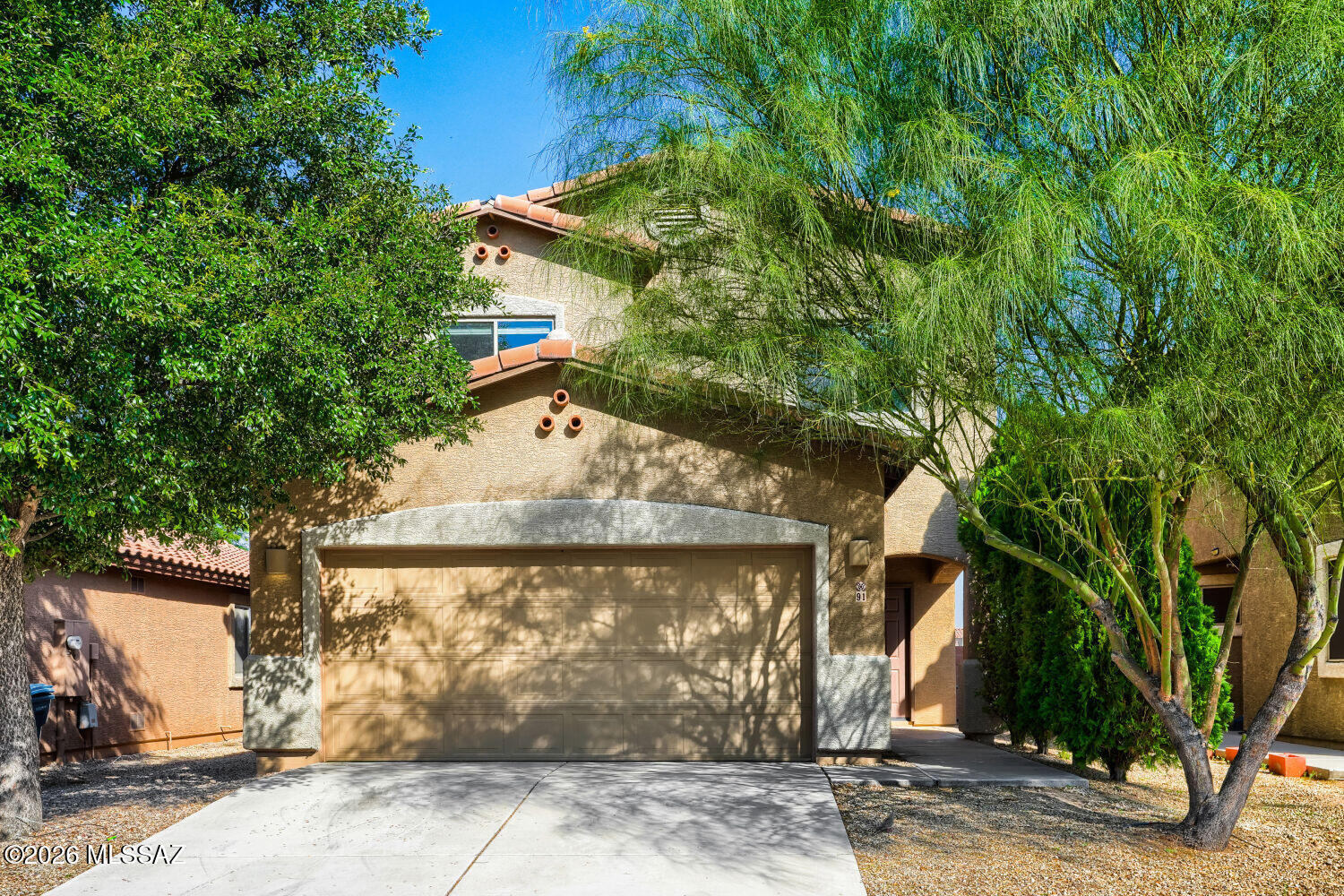This lovely 4-bedroom, 2.5-bathroom two-story traditional home is perfectly nestled in a highly popular, sought-after Sahuarita community, offering bright, flexible living areas designed to effortlessly accommodate both formal entertaining and relaxed daily living! Step inside to discover a freshly detailed interior featuring a spacious kitchen equipped with ample cabinet and countertop space, a highly practical lazy Susan for maximized storage, and a dedicated pantry. The main level transitions beautifully to a comfortable primary suite with refreshed bath finishes, alongside three additional well-sized bedrooms and a versatile bonus room.  Stepping outside, the low-maintenance backyard has been thoughtfully transformed into a private outdoor oasis, completely outfitted with decorative gravel, lush artificial turf, custom pavers, and a covered patio area that is absolutely perfect for hosting weekend barbecues or lounging in the shade with minimal upkeep required. Complete with a clean 2-car garage, powerwashed flatwork, and manicured landscaping, this turn-key home is ready for you to move right in!