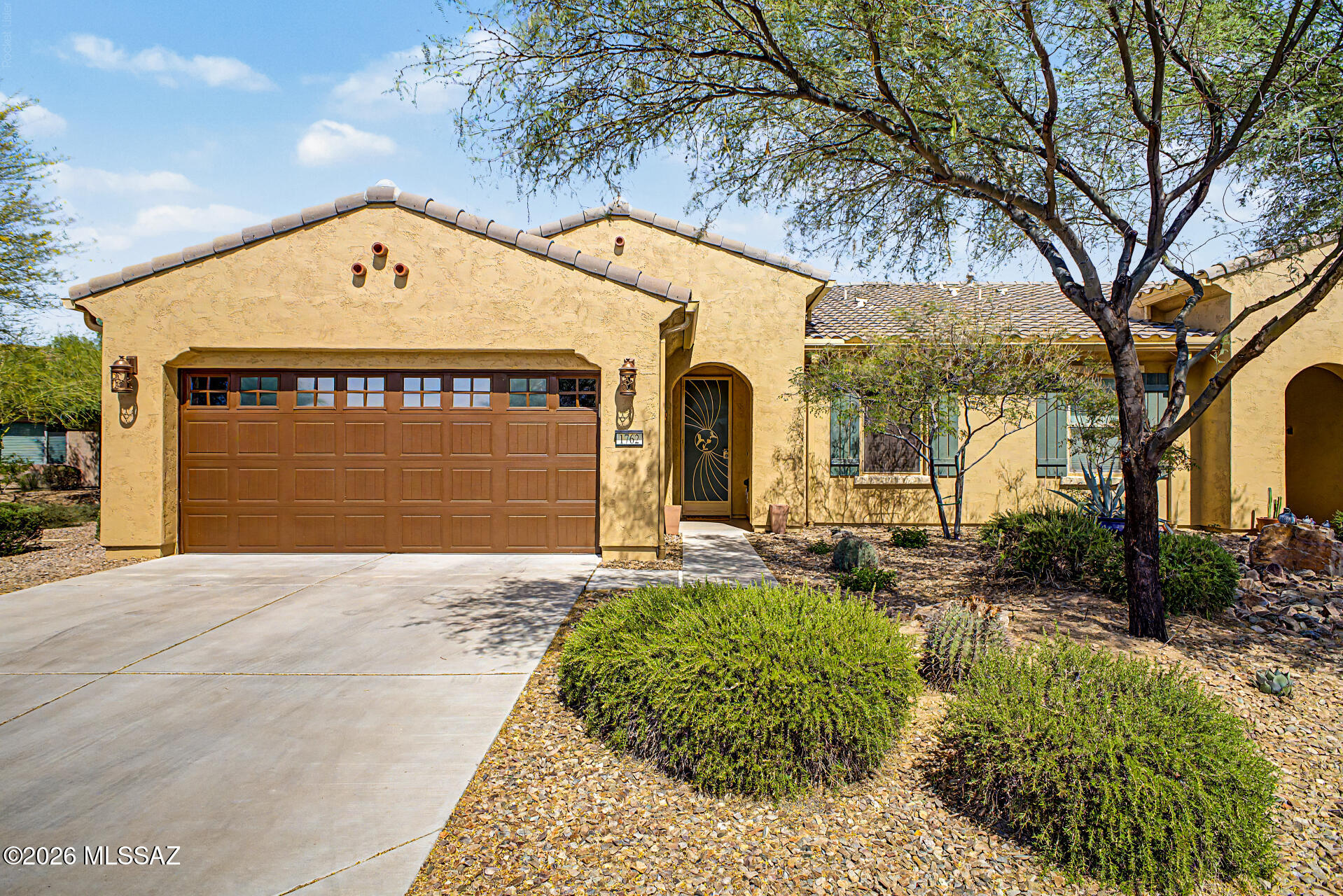 Private end-unit Villa with side & back open space and a large extended paved patio. This lock & leave home is in a quiet, completed neighborhood and loaded with upgrades: ceramic tile throughout (no carpet) for easy cleaning, wood blinds, Hunter Douglas patio Vertiglide, in wall fan controls and granite kitchen with stainless appliances. Open concept great room with lots of windows. You'll love the beautiful two-tone kitchen cabinets and big island. Thoughtful details include bedroom solar screens, comfort-height toilets, hot water recirculating pump, and primary bath with rainfall shower. Pristine garage with epoxy floors, Closet Trends cabinets, and a workspace/bench. Stylish front entry gate with big trees and open views.
Neutral palette, immaculate, and truly move-in ready. The biggest benefit there is to owning a villa is that the landscaping, exterior and roof are all covered. It's a truly lock and leave.