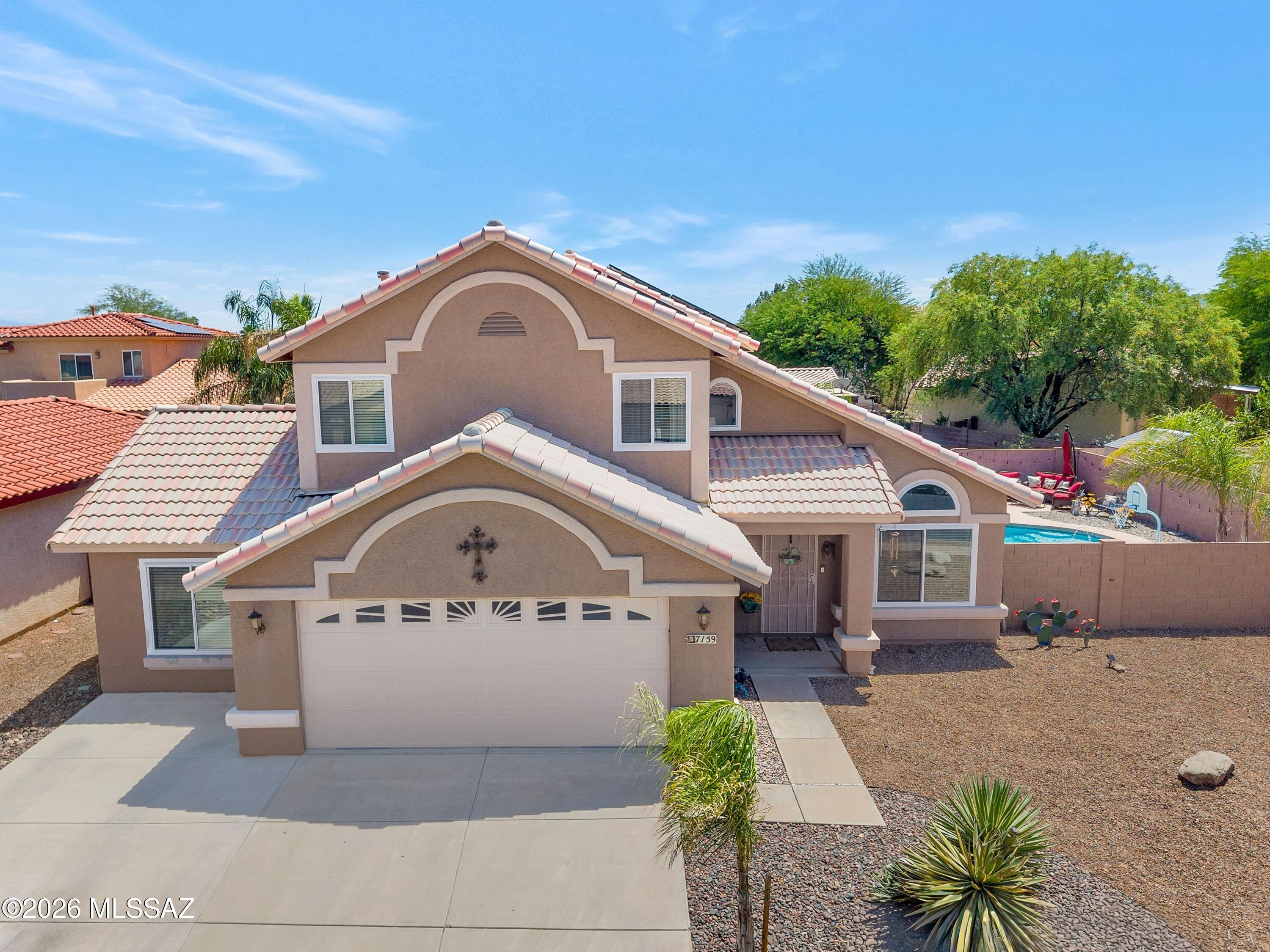 Welcome to this stunning two-story home in the heart of Continental Ranch, located in a vibrant family-friendly community. Overflowing with upgrades, this home is truly a rare find. The centerpiece is a sparkling backyard pool, perfect for entertaining or relaxing under the Arizona sun. With a newer AC unit and countless modern touches, this home is move-in ready. Home also has Solar lease!  Come see it today and experience the charm firsthand!