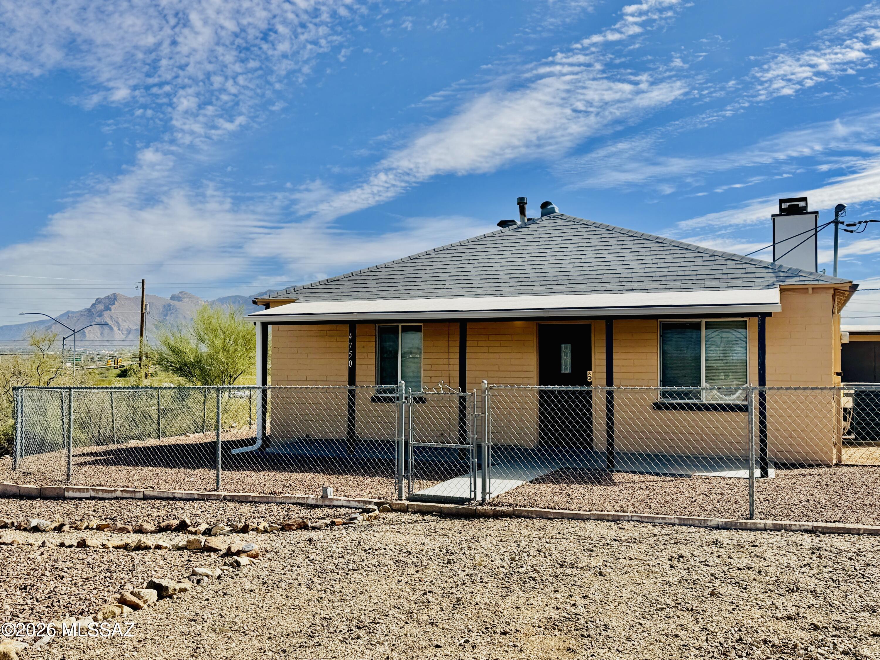 Adorable 2bed/2bath + Den Bungalow on Tucson's West Side. Nestled in the desert but close enough to hop on I-10 makes the location super convenient! Enjoy winters using the cozy living room and cool breezy nights in the Arizona Room located off the den. Polished concrete floors throughout with Saltillo tile in the spacious kitchen, den and bathroom. Large covered parking for 2 to keep your vehicles shady with additional lot space to spare. Mountain and desert views make this quaint spot a must see!