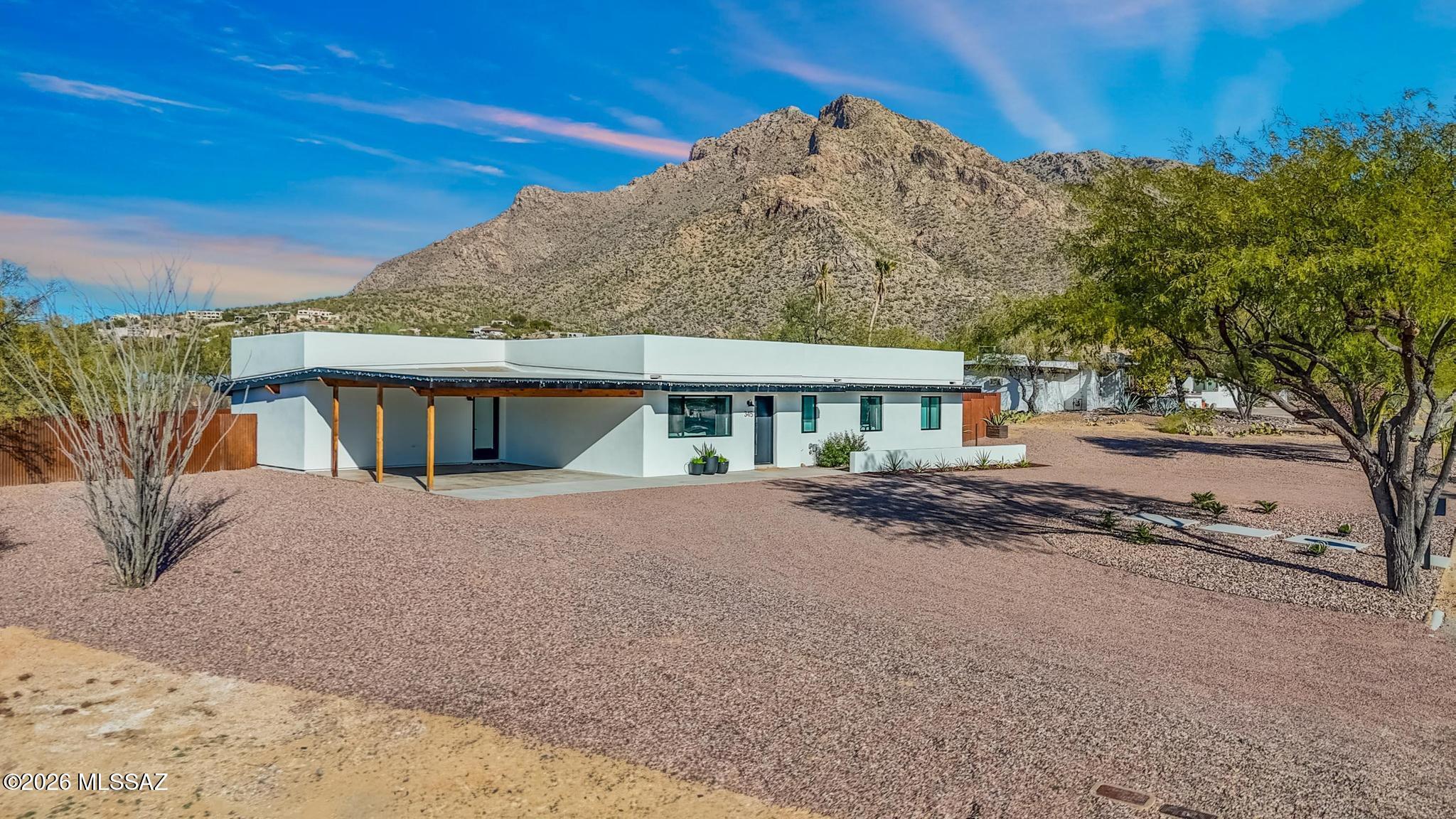Mountain views in your face! This almost entirely rebuilt home, is a stunning reflection of modern conveniences & contemporary style. Location is ideal for Oro Valley living. Enjoy the very flexible floorplan & outdoor living space for year round entertaining. So many upgrades-composite plank flooring, energy efficient  stainless appliances, quartz & granite countertops, 4th room could be den/office, generous laundry room. Roof, plumbing, HVAC, Electrical all upgraded/replaced-2 years old. A must see for your particular buyers. You won't be disappointed. Specific permits & contractors provided on Sellers Disclosure Statement. Upgrades list under Documents. See this home today!