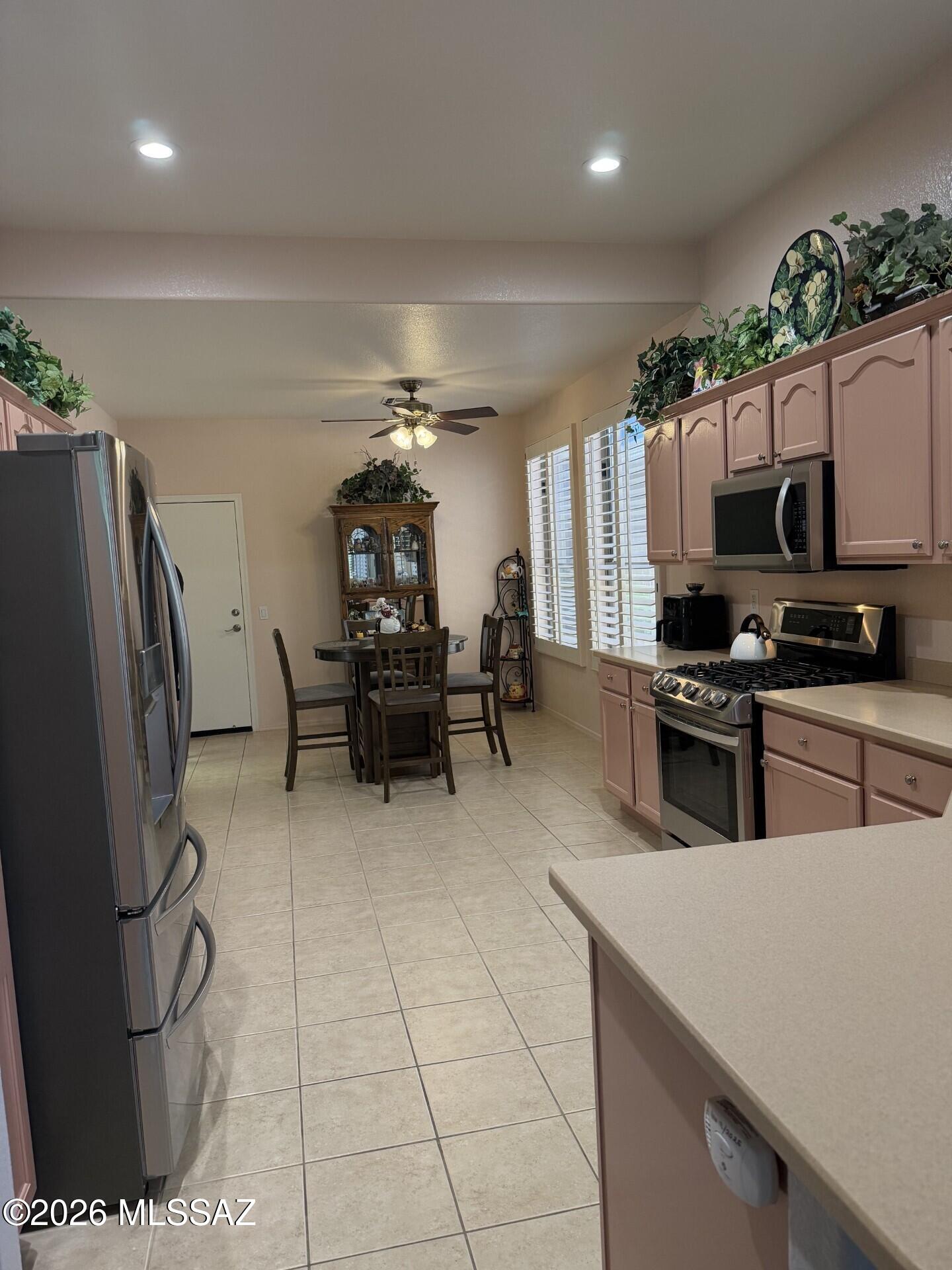 A really great villa on the golf course, sort of! See photos. Popular Portofino floor plan, high ceilings, tile floors and shutters throughout. Large eat-in kitchen w/ gas oven, stainless appliances, pull out shelves, pantry and plenty of cabinet and counter space. Owner suite is large, new shower and walk-in closet. A key point is the back screen porch w/ monsoon guard and the open backyard to the wall. Just beyond the trees is hole 7 of the Mountain View Golf Course. Life is good in the Villas. They paint ext of home, replace and maintain roof, pest control, landscaping, blanket insurance and so much more. Come see for your self.