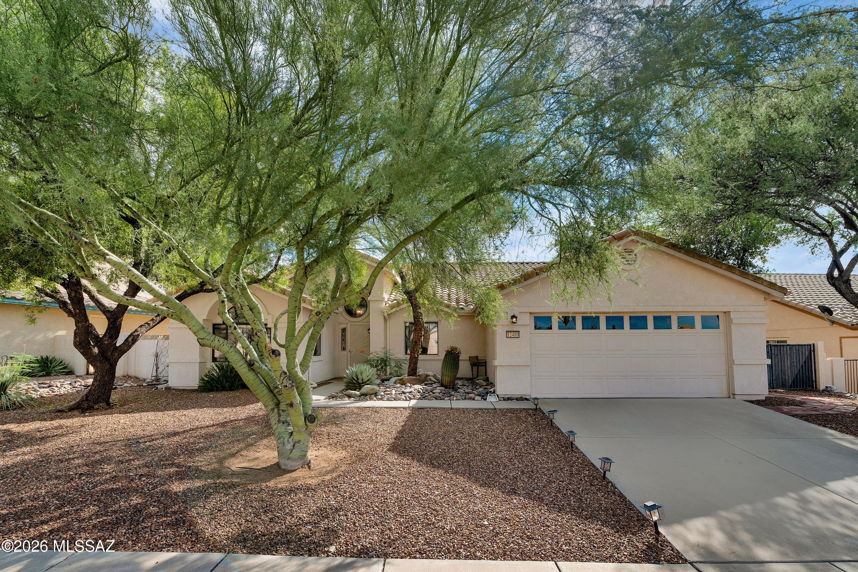 Welcome to an exceptional opportunity in the highly desirable Rancho Vistoso community of Oro Valley! Beautifully maintained and thoughtfully upgraded, this spacious 4-bedroom, 2-bath residence combines inviting Southwest living, impressive indoor-outdoor spaces, and stunning Pusch Ridge mountain views.

Step inside to a bright, welcoming floor plan featuring durable, dog-scratch-resistant wood-look laminate flooring, granite countertops throughout, modern fixtures, and a striking floor-to-ceiling stone-finished fireplace that creates a beautiful focal point in the living space. The well-appointed kitchen features granite countertops, stainless steel appliances, a gas range, built-in microwave, generous cabinetry, and a convenient breakfast nook. A formal dining room and spacious family room provide plenty of room for both everyday living and entertaining.

Retreat to the generously sized primary suite, complete with a large walk-in closet and private bath featuring granite finishes, a relaxing garden tub, and a tiled walk-in shower with glass enclosure. Three additional bedrooms provide flexibility for guests, a home office, hobbies, or additional living space. The laundry room offers upper cabinetry and overhead storage for added convenience, while a Culligan water softener system adds another desirable feature.

The backyard is designed to take full advantage of the Arizona lifestyle. Step beneath the full-length covered patio and enjoy beautiful views of Pusch Ridge while relaxing or entertaining. Cool off during the warmer months in your private spool, or enjoy the generously sized yard featuring newly installed artificial turf, flagstone accents, and plenty of space to gather with family and friends.

Adding further peace of mind, the home's plumbing has been updated with no polybutylene piping, with the work completed under required city permits.

Located in sought-after Rancho Vistoso, this immaculate Oro Valley home offers an exceptional combination of space, upgrades, mountain views, and outdoor living. Homes with this much to offer deserve to be experienced in person--schedule your private showing today!