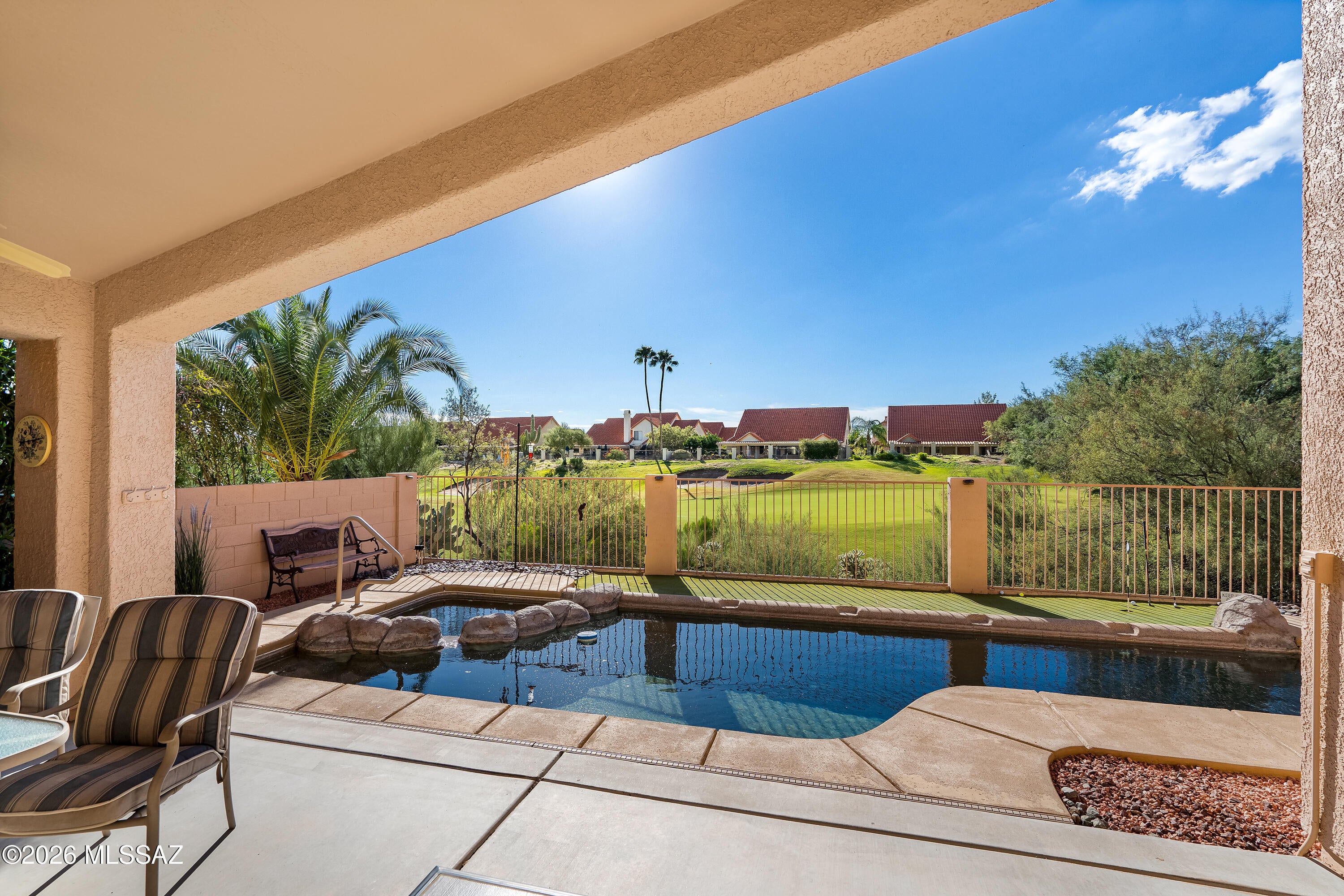 Nestled along the El Conquistador Golf Course, this home offers views of the 2nd green and an exceptional Oro Valley location. The desirable great room floor plan creates an an open and inviting space for everyday living and entertaining. A split-bedroom layout provides separation between the primary suite and secondary bedrooms. Step outside to enjoy the self-cleaning Pebble Tec pool and spa, perfect for relaxing while taking in the peaceful golf course setting. Conveniently located near shopping, dining, Oro Valley Recreation Center, Naranja Park and access to multi-use paths that lead to ''The Loop''. This home combines comfort, functionality, and a sought-after golf course lifestyle in the heart of Oro Valley.
