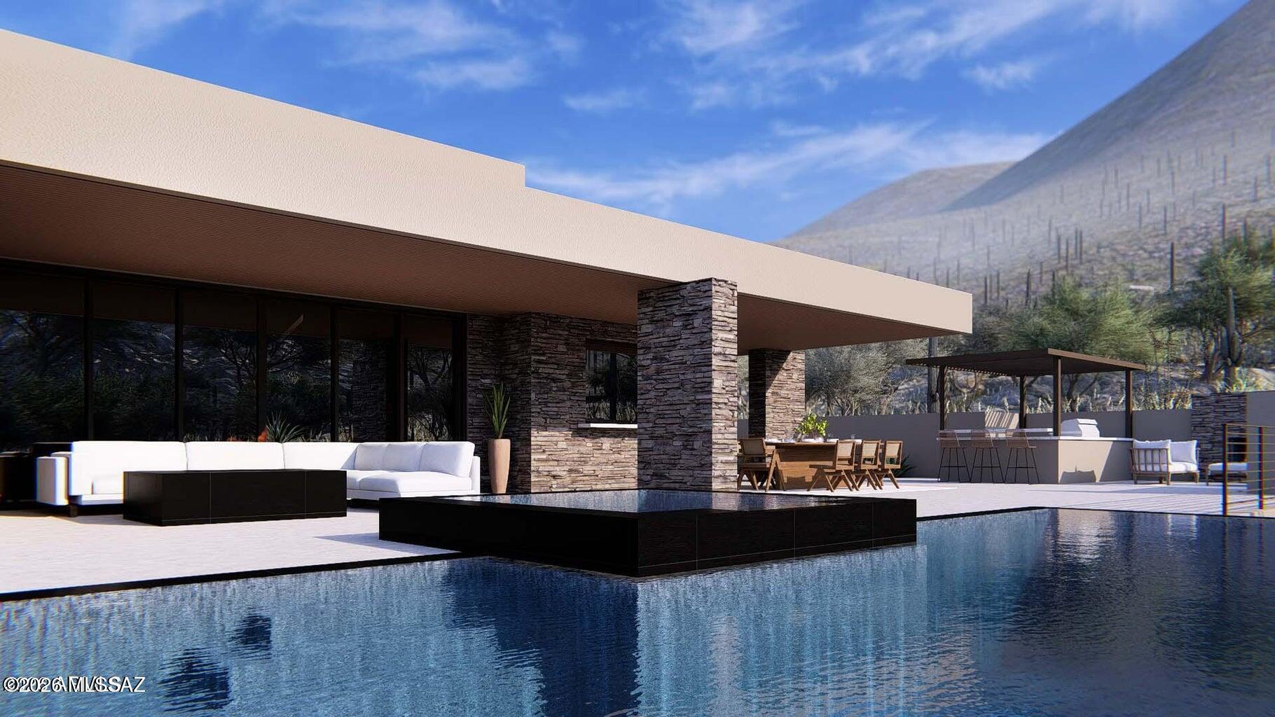 Luxury living in a one of a kind serene mountain custom estate in Saguaro Ranch. Enter through the iconic tunnel & through the guard
gated entry to this rare luxury estate showcasing the design by architect Ron Robinette, build by RB Construction & interior design by Lori Carroll. Delivery
late 2026. Premium 1 acre lot on a cul de sac. Sweeping mountain views of the Catalina Mountains & Mount Lemmon to the east. Features the highest
finishes & outdoor living in the resort style backyard. Open floor plan with soaring ceilings & ultimate privacy in each ensuite bedroom. Chef's kitchen with
quartzite countertops, butler's pantry & expansive wine cooler. Enjoy the community amenities membership with lap pool, heated spa, pickle ball, gym & clubhouse. Enjoy world class golf within minutes.