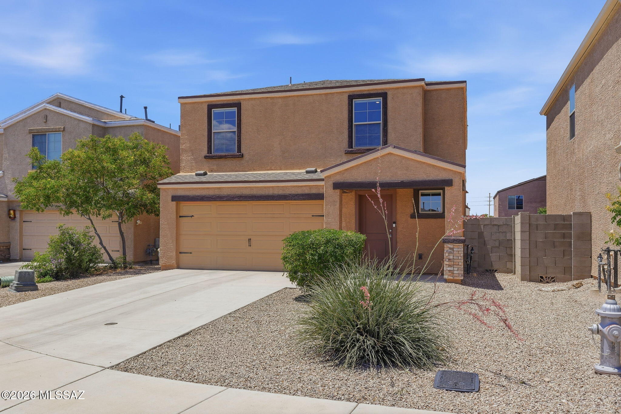 Beautiful, bright, well-maintained two-story home features an open floor plan for flexible living. Energy-efficient kitchen appliances, granite countertops, dual-pane windows throughout with upgraded coverings. The front yard offers low-care landscaping, while the fully enclosed backyard is a clean slate for your dream landscape or swimming pool! With one bedroom and one bath downstairs, and 4 additional bedrooms and two baths upstairs, this home would be perfect for a next-gen family, or large family needing space. Extra loft area upstairs can be used as an office/media or play room. Excellent location with easy access to Davis Monthan AFB, Tucson international airport, schools, shopping, cinema, and The Loop for cycling enthusiasts.