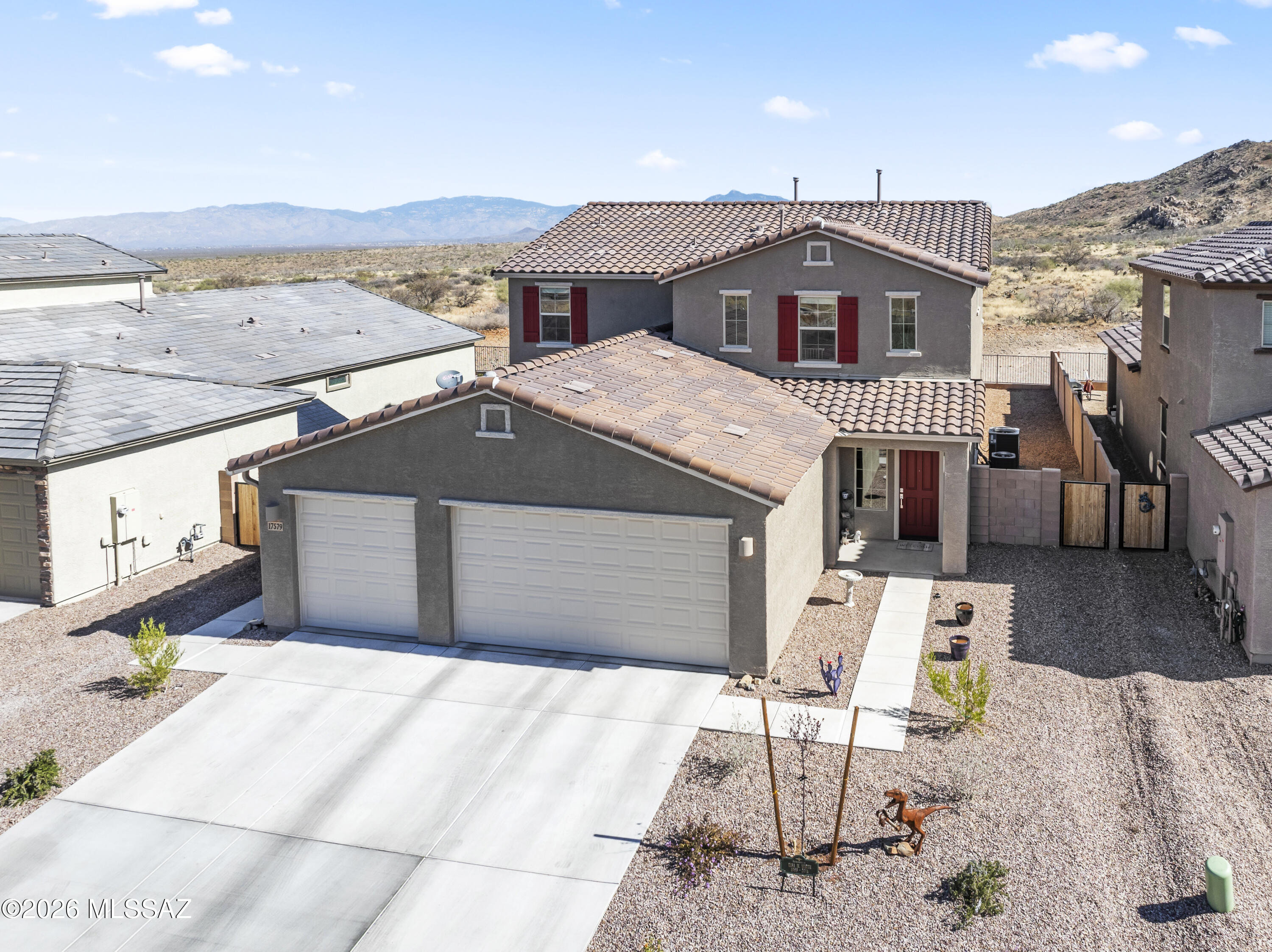 NextGen home on premium lot! Offering $5000 in closing costs! Situated with no neighbors behind, this property captures sweeping views and a sense of openness that is hard to find. The rear yard is fully landscaped, creating an inviting outdoor space ready to enjoy from day one. The thoughtfully designed layout includes a private 1-bedroom suite with its own entrance and yard, ideal for extended living, guests, or a separate retreat. The main home features 3 bedrooms along with dual living areas, including an upstairs loft and a spacious gathering space off the Super Kitchen, perfect for everyday living and entertaining. Move-in ready and designed for versatility, this home offers a unique opportunity to enjoy both privacy and connection in a highly desirable setting