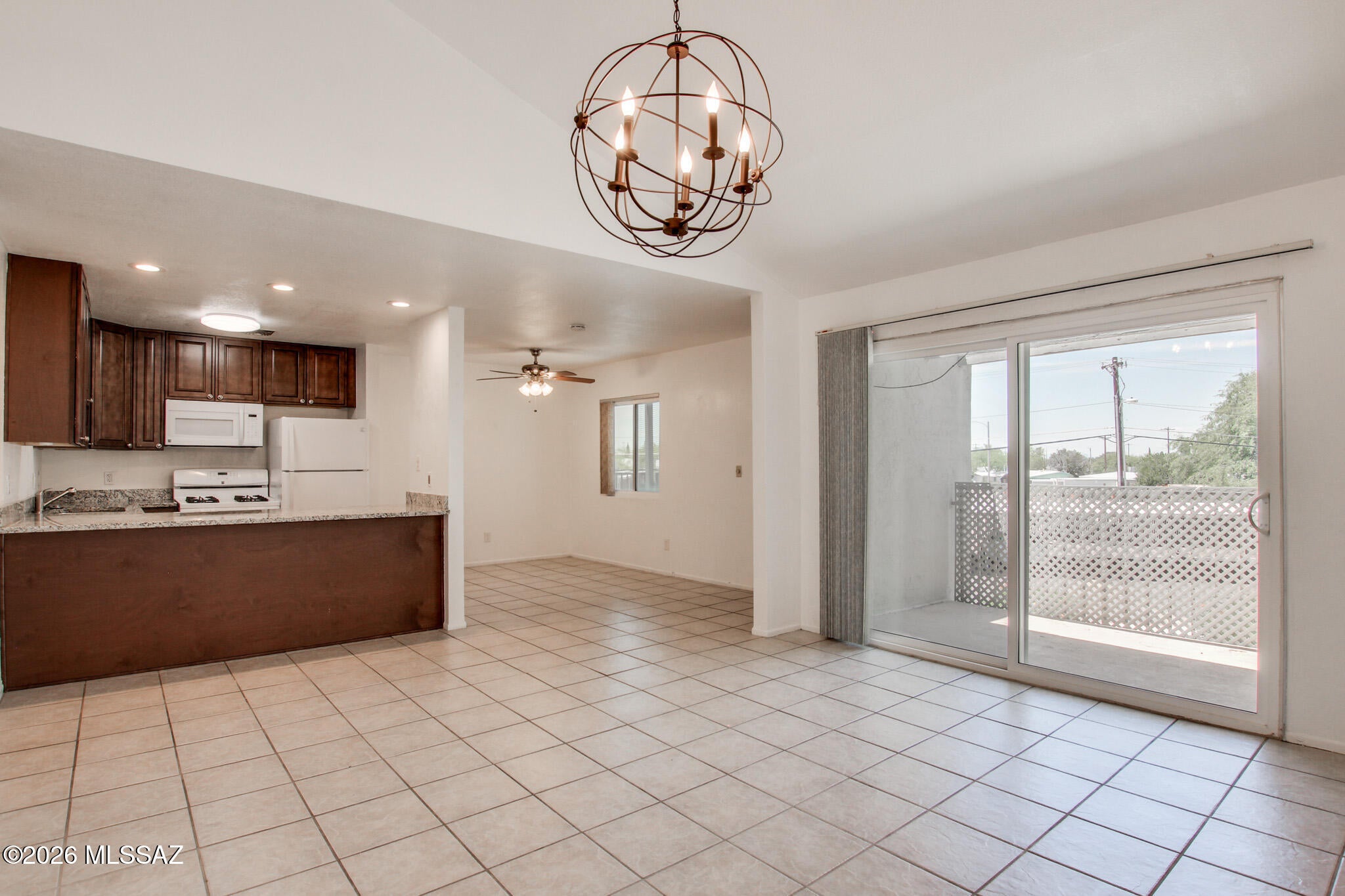 Welcome to Langley Gardens Condominiums, where comfort meets convenience! Ideally located just minutes from Davis-Monthan Air Force Base, shopping, restaurants, and everyday amenities, this move-in-ready condo offers an open layout with soaring vaulted ceilings, granite countertops, rich wood cabinetry, and indoor laundry. The beautifully remodeled primary and guest bathrooms add a modern touch, while the private balcony is the perfect spot to enjoy Arizona sunsets. Community amenities include a pool, dog run and club house. Experience effortless modern living on Tucson's Eastside. Schedule your showing before its gone!