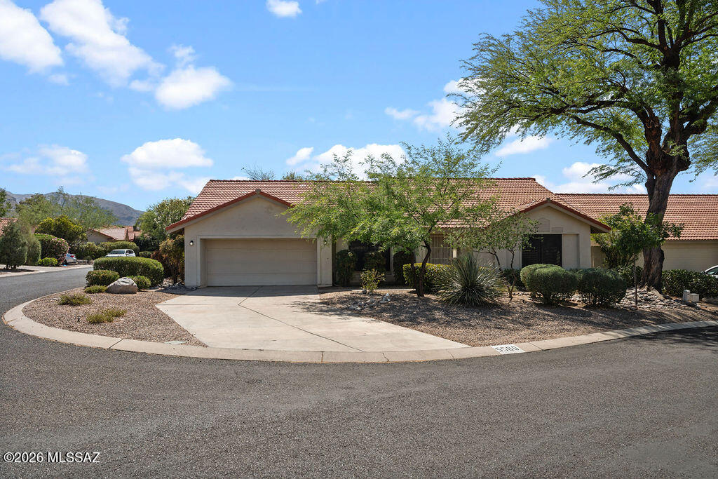 Open & bright is this exceptional 3 or 4 bedroom, 2 bath home close to Sabino and Ventana Canyon.  This home features newer appliances including washer/dryer.  Warm fireplace, tile. Rear yard has covered patio, low maintenance with a high wall.  Community pool just steps away.  Great location close to shopping & restaurants.  All electric home.