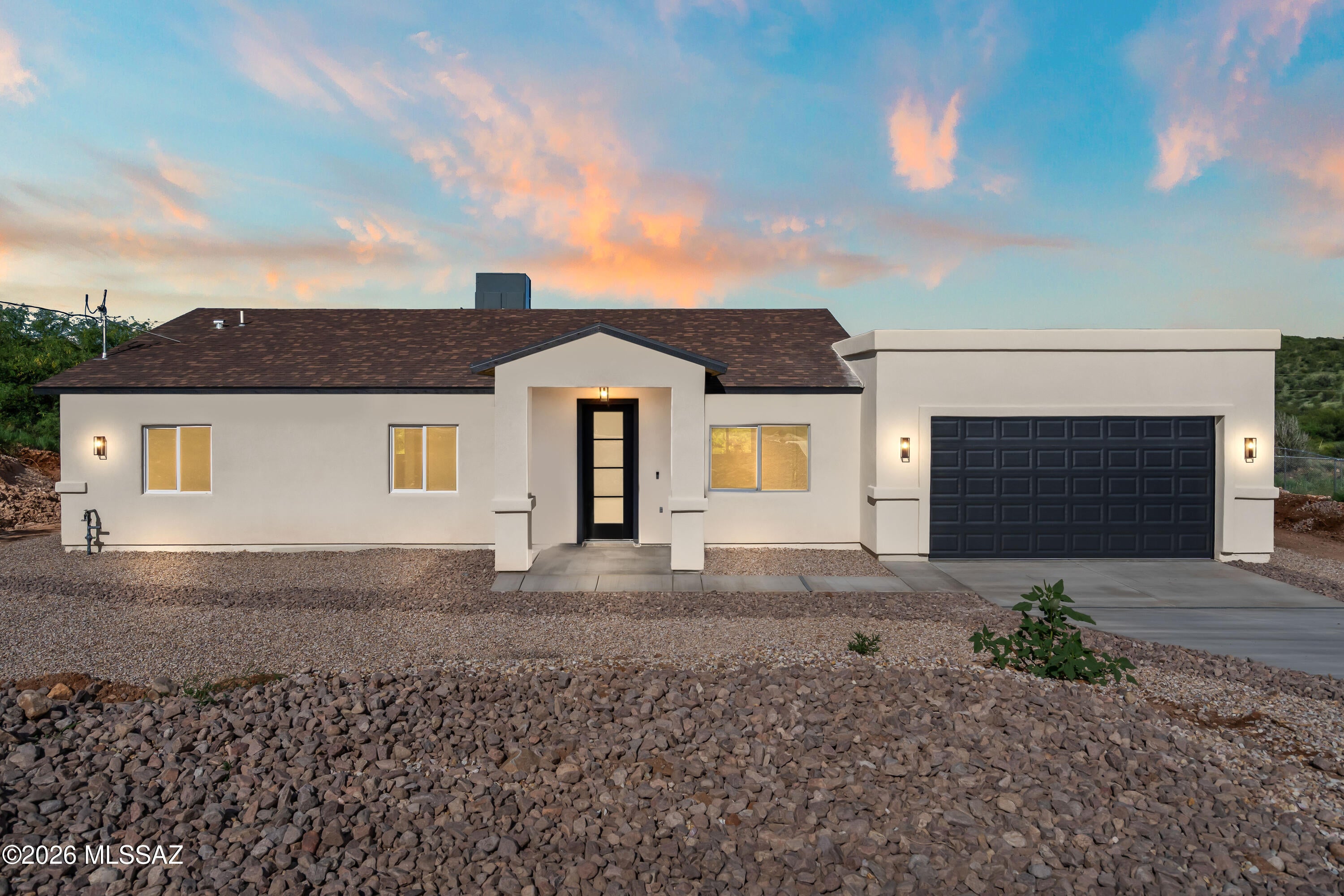 Perched on a scenic hillside, this 3-bedroom, 2-bathroom home offers 1,639 sq ft of modern living with breathtaking mountain and city views. The elevated lot provides privacy while showcasing sweeping vistas from multiple areas of the home. Inside, clean lines and contemporary finishes define the space, including quartz countertops and large-format 24x48 ceramic tile flooring for a sleek, low-maintenance feel. The open layout seamlessly connects the kitchen and living areas, ideal for everyday living and entertaining. With its blend of style, function, and unbeatable views, this hillside property offers a rare opportunity for refined living.