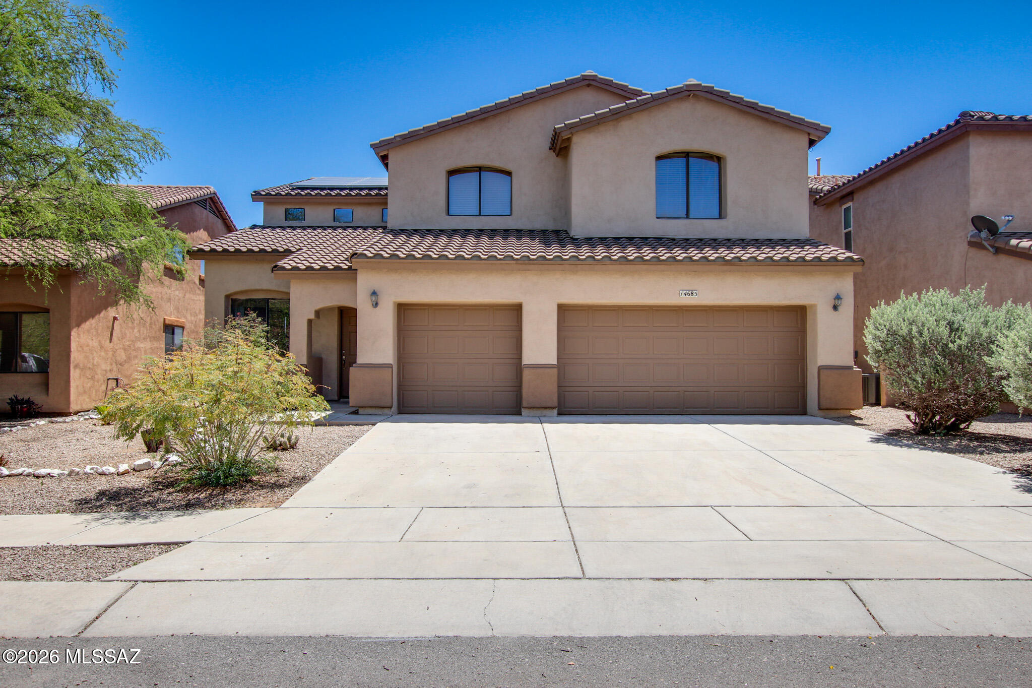 Priced to sell! Beautiful 5-bedroom, 3.5-bath home with a spacious loft, tesla paid-off solar, and brand-new carpet throughout. Enjoy stunning views from the backyard and second-story balcony with no rear neighbors offering an endless portrait view creating added privacy and an open, peaceful setting. The freshly painted exterior enhances the home's curb appeal, while the open floor plan provides plenty of space for comfortable living and entertaining. Located in the desirable Rancho Sahuarita community with access to a lake, pools, parks, skate park, basketball courts, walking trails, and more. Move-in ready and an exceptional value in a sought-after neighborhood.