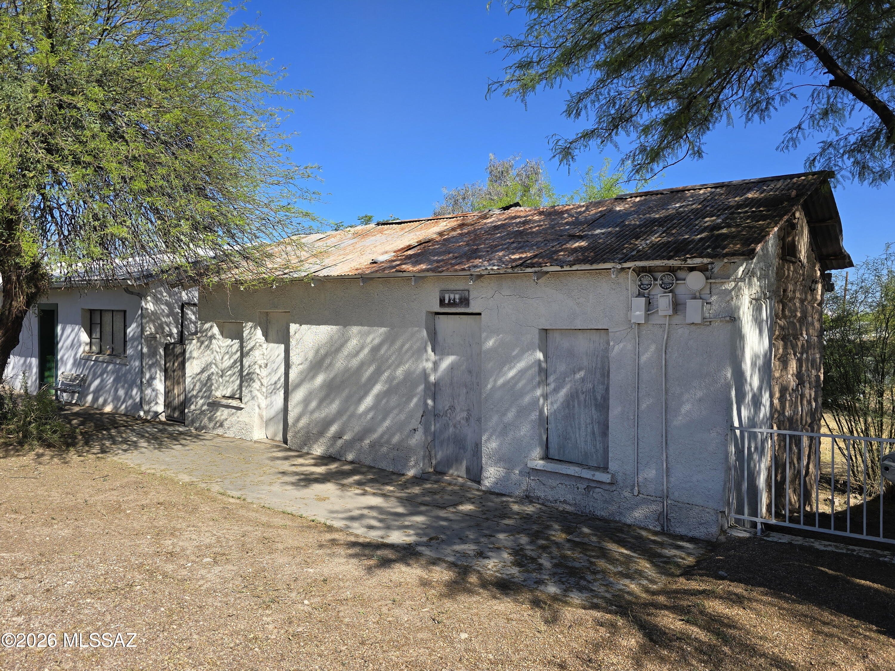 Don't miss the opportunity to create something truly unique in downtown Tucson's historic Barrio Viejo District. This property features a historic adobe home built in the early 1900s and is ideally located near exceptional shopping, entertainment, and world-renowned dining. Situated just off I-10 and within walking distance to the Tucson Sun Link streetcar, El Mercado, Tucson Convention Center, and scenic bike and walking paths, the location offers both convenience and character. Utilities are available nearby, and plans have been created allowing for a seamless development that blends new construction with the rich architectural heritage of the area. The property is being sold as-is; the seller will make no repairs, and buyers are responsible for activating utilities at their own expense for inspections if desired.