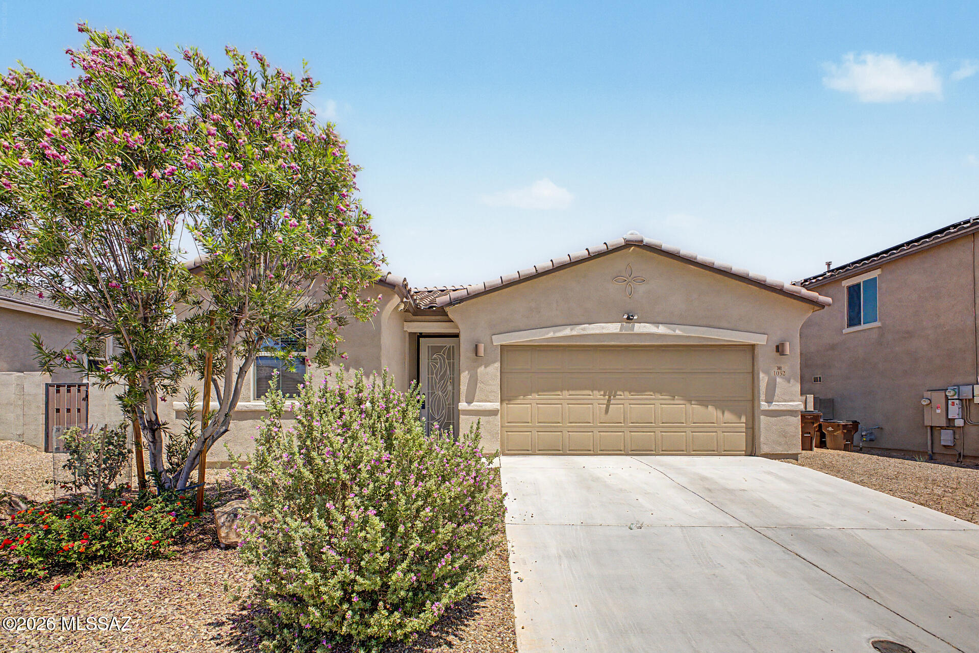 Welcome to this stunning 4BR/2BA + den home in the sought after master planned community of Rancho Sahuarita! Better than new, this immaculate residence features an open-concept layout with a spacious den ideal for a home office or flex space. The gourmet kitchen boasts upgraded finishes, ample cabinetry, and a large island perfect for entertaining. The primary suite offers a luxurious en-suite bath and generous closet space. Three additional bedrooms provide plenty of room for everyone. Enjoy Rancho Sahuarita's resort-style amenities, including a lake, pools, parks, and walking trails. All minutes from shopping, dining, and top-rated schools. Don't miss this move-in-ready gem!