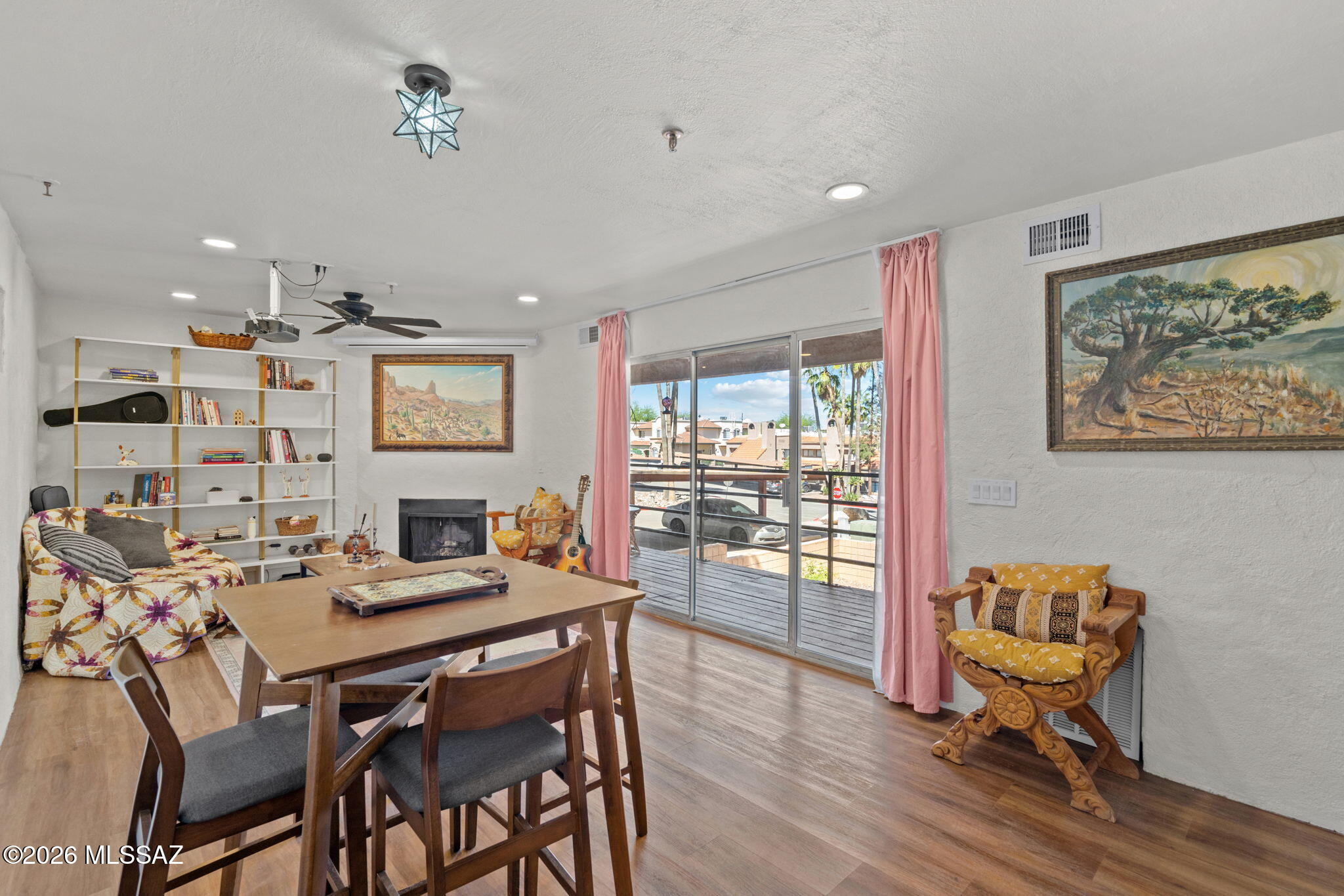 Looking for something stylish, low-maintenance, and close to everything? This fully updated 1 bed, 1 bath checks all the boxes--located just minutes from the University of Arizona and Pima Community College.

Inside, you'll find a beautifully refreshed kitchen with new cabinets, countertops, and appliances, plus a spa-like bathroom featuring a steel tub and custom tile surround. Luxury vinyl floors throughout give the home a cohesive and low-maintenance vibe.

Cozy up next to the fireplace or enjoy movie nights with the included projection television--already set up for you!

The community features a grassy common area and assigned covered parking.