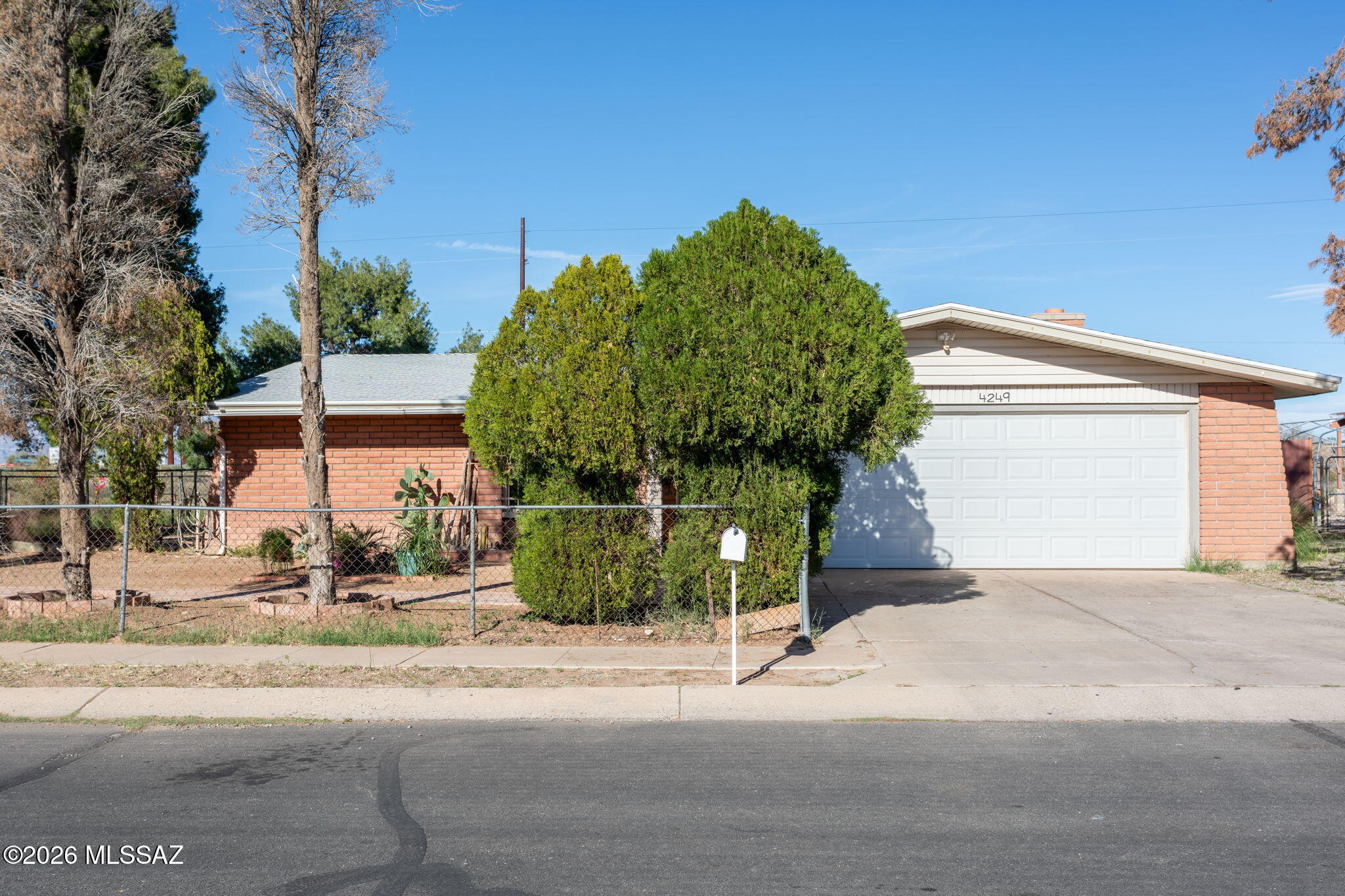 This well-maintained single-story home welcomes you with clean lines and an airy ambiance from the moment you step inside. Designed for comfort, style, and low-maintenance living, the inviting exterior showcases classic brick construction, a spacious two-car garage, mature trees, and a fully fenced front yard that offers added privacy and curb appeal. This home offers 4 bedrooms, 2 bathrooms, 1,404 SF, a corner lot, spacious side and back yard with lots of potential, only one neighbor to the left of the house, wide streets, on a really clean and quite neighborhood, close to walking paths, parks and close to I-10. The interior features a bright living area highlighted by neutral tile flooring throughout, providing durability and easy upkeep. A stylish wood-accent feature wall serves as a w a warm and inviting focal point in the main living space, while updated ceiling fans and abundant natural light enhance the open feel of the home. The kitchen is thoughtfully updated with modern neutral-toned cabinetry, warm butcher-block countertops, sleek stainless steel appliances, and a timeless subway tile backsplash. Ample cabinet and counter space make it ideal for both everyday living and entertaining. The bathroom has been tastefully remodeled with contemporary tile work, a sleek vanity, and a shower/tub combination accented by modern fixturesdelivering both functionality and refined style. Neutral finishes throughout create a cohesive look and make this home truly move-in ready. Whether you are a first-time buyer, looking to downsize, or seeking a smart investment opportunity, this property offers exceptional value and comfort.