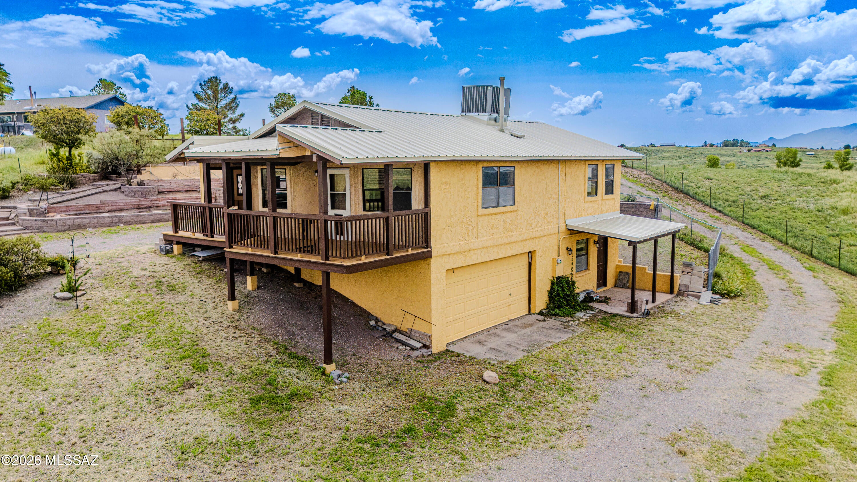 Welcome to 8 Chula Court, your slice of Sonoita paradise! Nestled on nearly 3 acres of serene Arizona countryside, this charming home offers comfort, space, privacy, and potential. Recent upgrades include a new standing seam metal roof and HVAC system, both installed in July 2026. Inside you'll find 2 bedrooms, 2.5 baths, a spacious great room, and a downstairs bonus room offering flexible space for an office, hobby room, guest room, or more. Outside, enjoy breathtaking mountain views, wide open skies, and a fully fenced property ideal for horses, gardening, outdoor projects, or simply enjoying the peaceful country setting. Located in the heart of Arizona wine country, you're minutes from vineyards, trails, and Sonoita's small town charm.