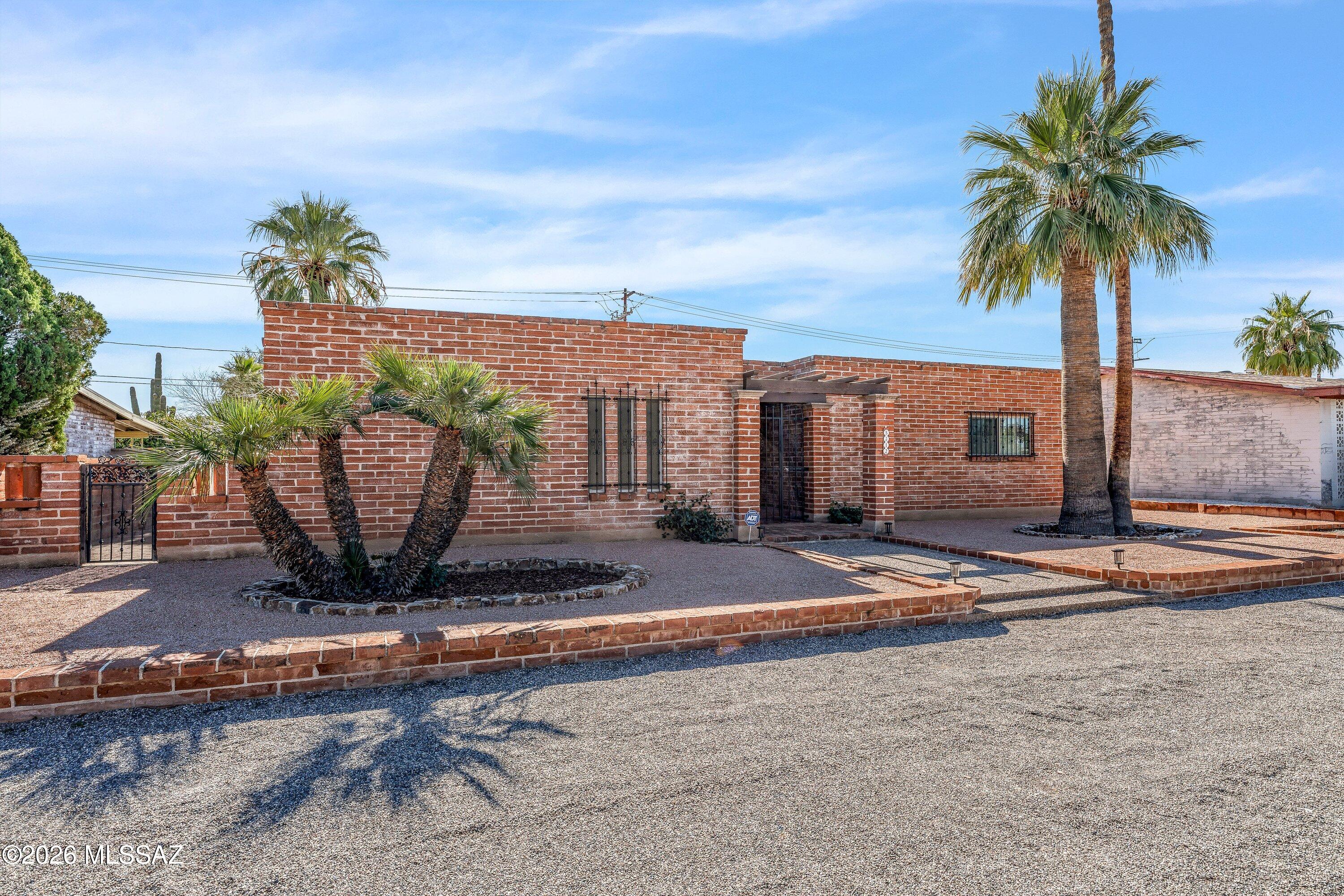 Don't miss this beautifully remodeled Mid-Century home. Everything has been done! Newly painted interior and exterior. This home features a stunning updated kitchen with new cabinetry and granite countertops. New wood-look vinyl flooring throughout. Updated fixtures with large laundry/storage room with ample storage. Brand new energy efficient windows. The integrity of the mid-century design has been thoughtfully maintained, including original built-in cabinetry. Bathrooms fully remodeled offers spa-like feel, and a primary bedroom includes a spacious walk-in closet. Enjoy a private low-maintenance backyard with oversized separate workshop-perfect for storage, or hobbies. Conveniently located near shopping, transportation, and the U.O.A. Great central location. No HOA bring your toys. Primary has 2 closets one a large walk in. Primary bathroom spa like, with double sinks. Central location close to everything!