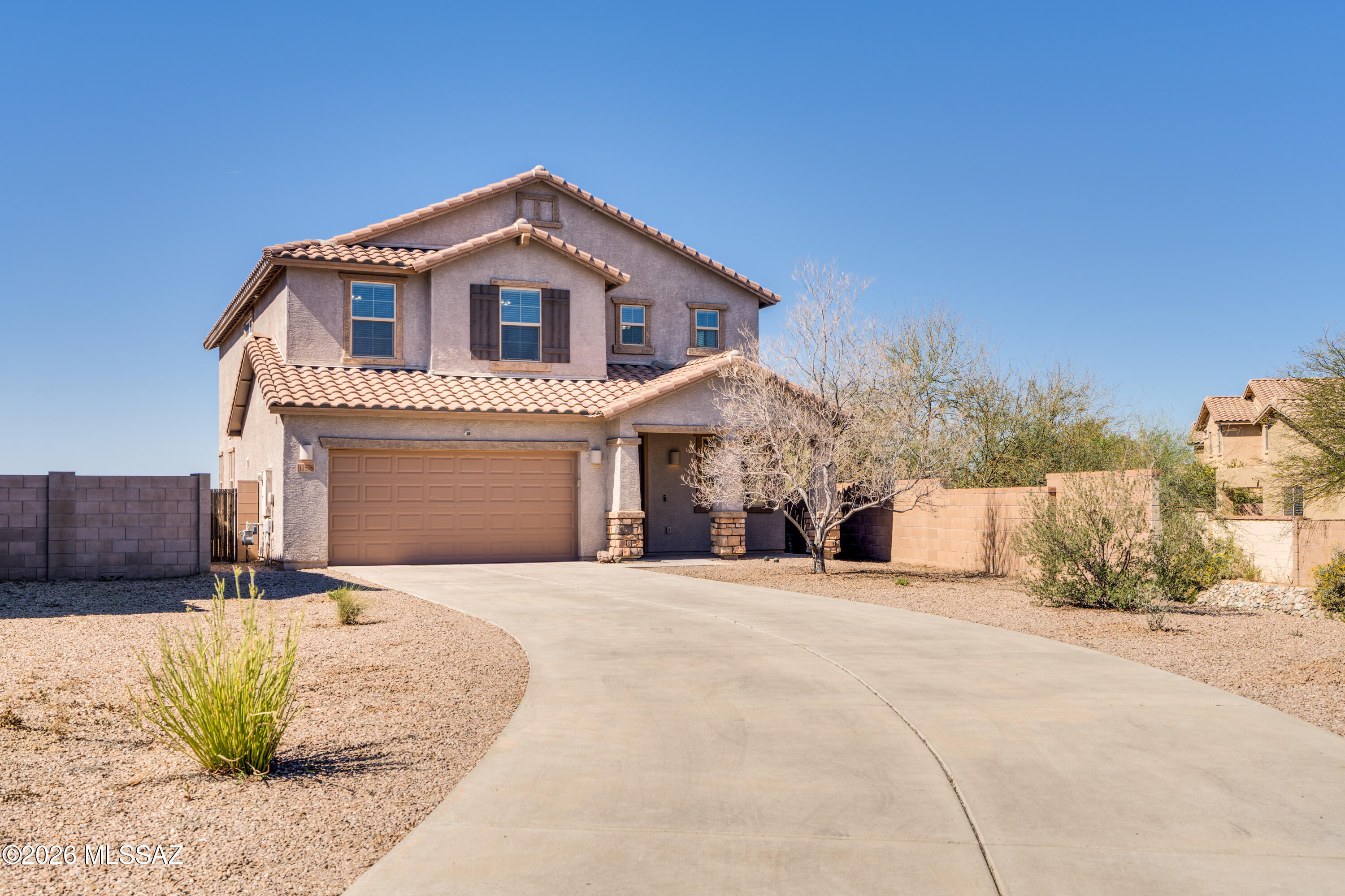Experience breathtaking sunsets and panoramic mountain views from this beautifully maintained 5-bedroom, 3 bath home tucked at the end of a quiet cul-de-sac. Freshly painted with soaring ceilings and an open-concept kitchen featuring granite countertops, this move-in ready home offers both comfort and style.  The versatile floor plan includes a bedroom and full bath on the main level, a spacious loft, and a serene primary suite with a spa-like oversized shower.  Step outside to an expanisve backyard full of  possibiites - perfect for designing your dream outdoor oasis and enjoying the  endless beauty of desert skies. A separate paver area is ready for your future jacuzzi retreat. Set back from the street with a long driveway, this home offers privacy, space, and unforgettable views.