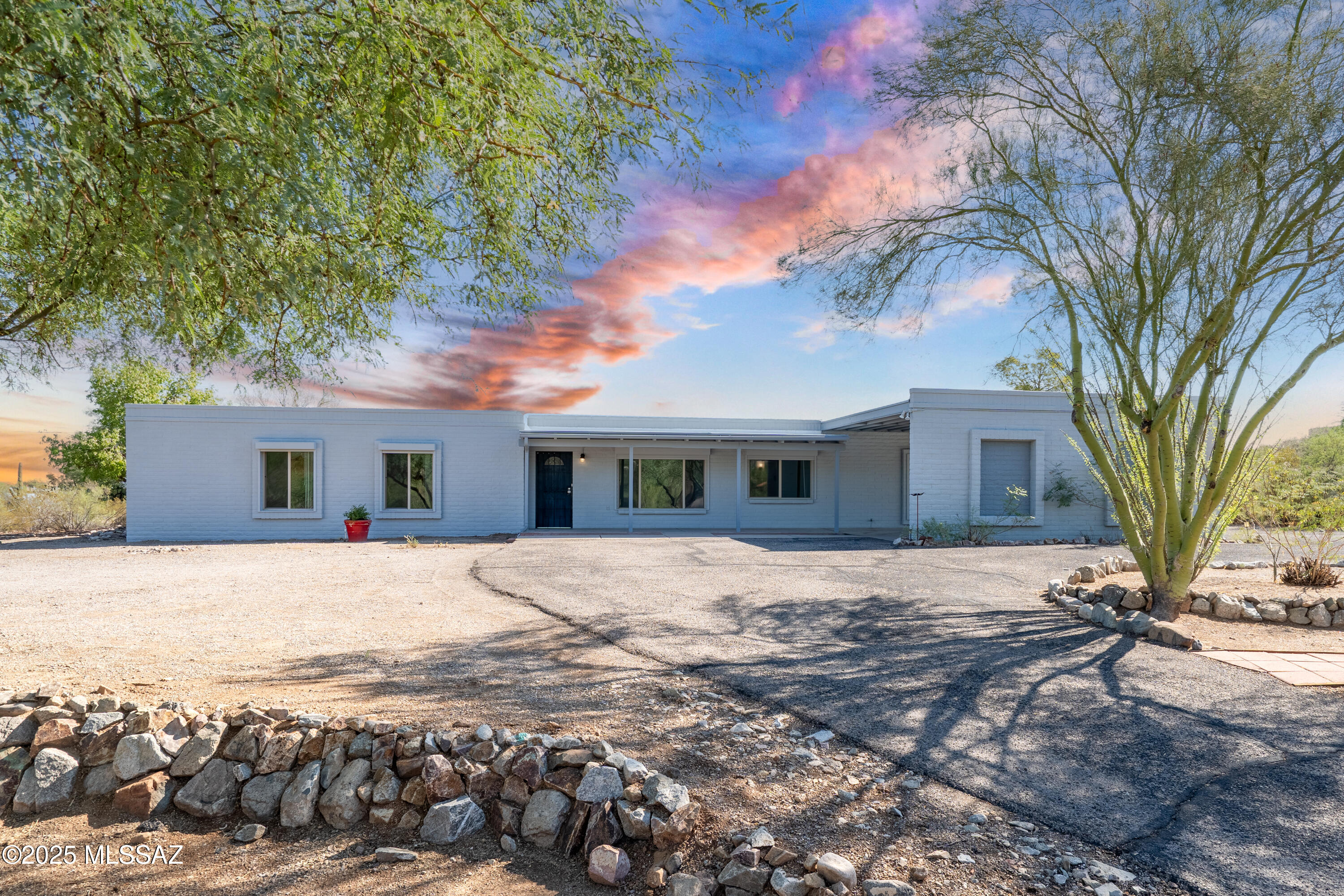 Beautifully Updated Home in West Tucson. Nestled in the scenic Tucson Mountains with expansive mountain views and abundant wildlife, this remodeled 3-bedroom, 2-bath home sits on over an acre. Located in the desirable Rancho del Cerro neighborhood, you'll enjoy the tranquility of the desert while still being minutes from Starr Pass Golf Club, downtown Tucson, and easy I-10 access. This charming slump block home has been thoughtfully updated inside and out: New dual-pane windows with rolling shutters Refurbished roof with elastomeric coating and 2-year certification. New AC, furnace, and mini-split system in the family room. Remodeled kitchen featuring new cabinets, quartz countertops, modern fixtures, and Frigidaire stainless appliances. Click More. More... Remodeled primary bath with new shower, vanity, plumbing, and fixtures

New luxury vinyl wood plank flooring, lighting, baseboards, closet doors, and hardware throughout

Fresh interior and exterior paint for a move-in ready feel

Additional highlights include a cozy fireplace, ceramic tile in two bedrooms and hall bath, covered patio and porch, and two storage sheds. The enlarged leach field, new water heater, and ceiling fans add to the comfort and functionality.

This home offers the perfect blend of modern upgrades, privacy, and desert beauty in one of West Tucson's most scenic communities.