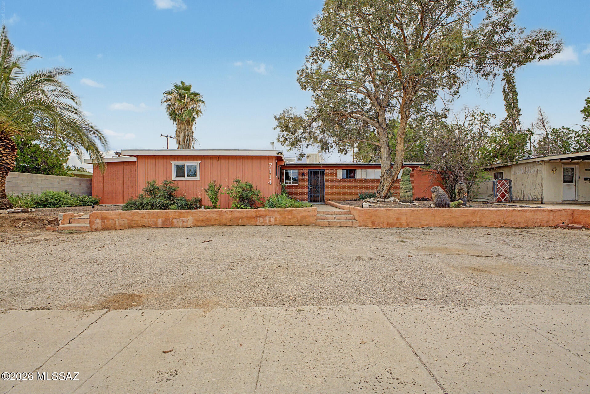Charming single-story home with pool & guest quarters is now on the market! Inside, you'll find a bright and spacious living room perfect for gathering with friends and family, featuring stained concrete flooring, a cozy fireplace, abundant natural light, and neutral paint. The kitchen comes equipped with wood cabinetry, a tile backsplash, tiled countertops, a breakfast bar, and built-in appliances for a seamless cooking experience. Four spacious bedrooms await you and your loved ones, with 4 bathrooms for extra convenience. You won't have to worry about your guests' privacy and space with the guest quarters, which include a kitchen. Out back, you'll have plenty of room for entertaining, complete with a sparkling pool to enjoy sunny days! Hurry up and check it out now!