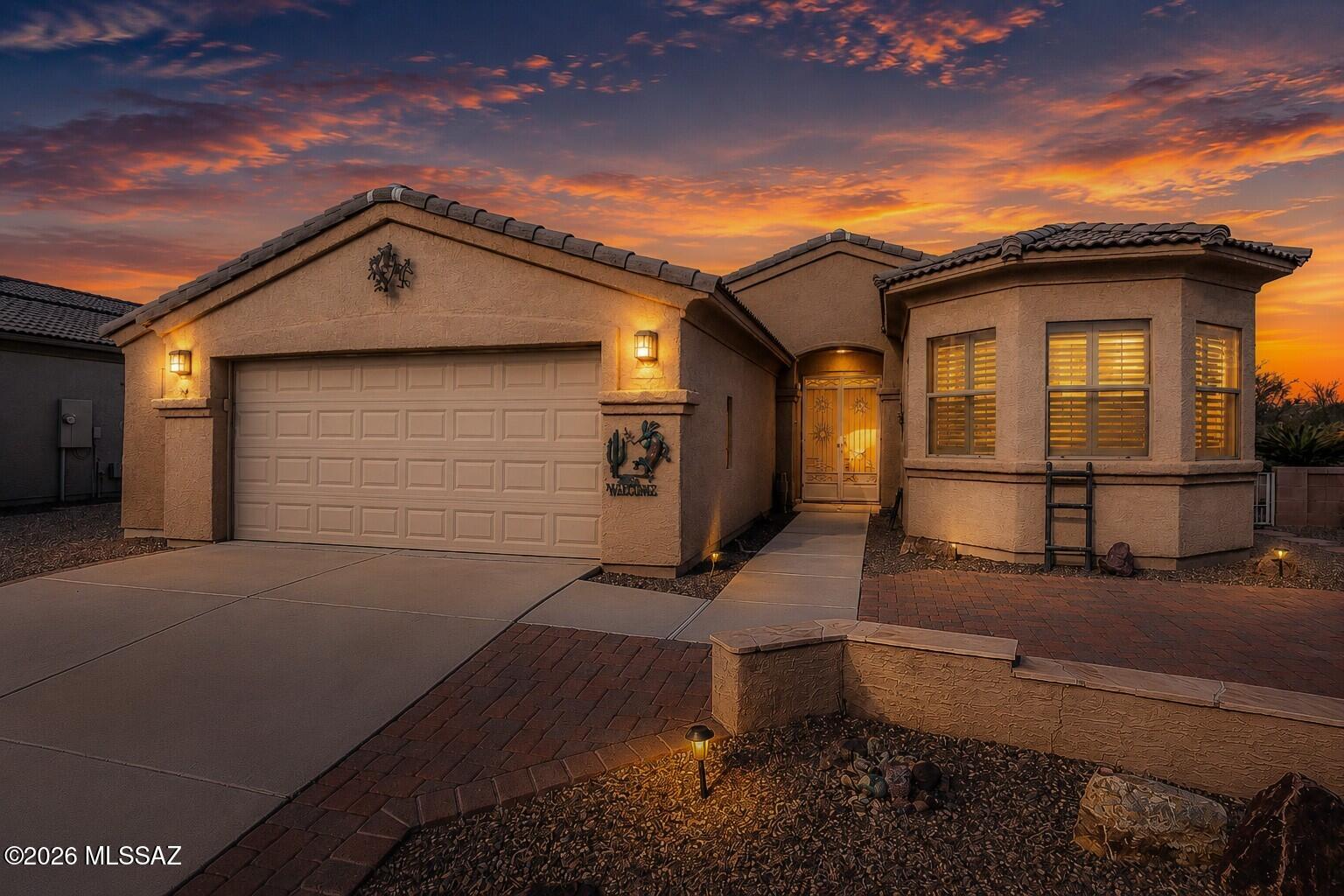 Discover a comfortable Arizona retreat with the added peace of mind of a completely redone roof in 2026, in this gated 55+ community conveniently located near multiple GVR centers. Inside, the open floorplan creates an inviting flow between living spaces, while the updated kitchen showcases granite countertops, a stylish glass tile backsplash, and upgraded cabinetry. Durable tile and wood laminate flooring offer a clean, low-maintenance finish throughout the home. Multiple flex spaces allow you to customize the layout for an office, craft room, or favorite hobby. The oversized 2.5-car garage features ample storage. Step into the enclosed AZ room and enjoy the tranquil backyard with no rear neighbors--a wonderful place to relax and appreciate the Arizona landscape.
