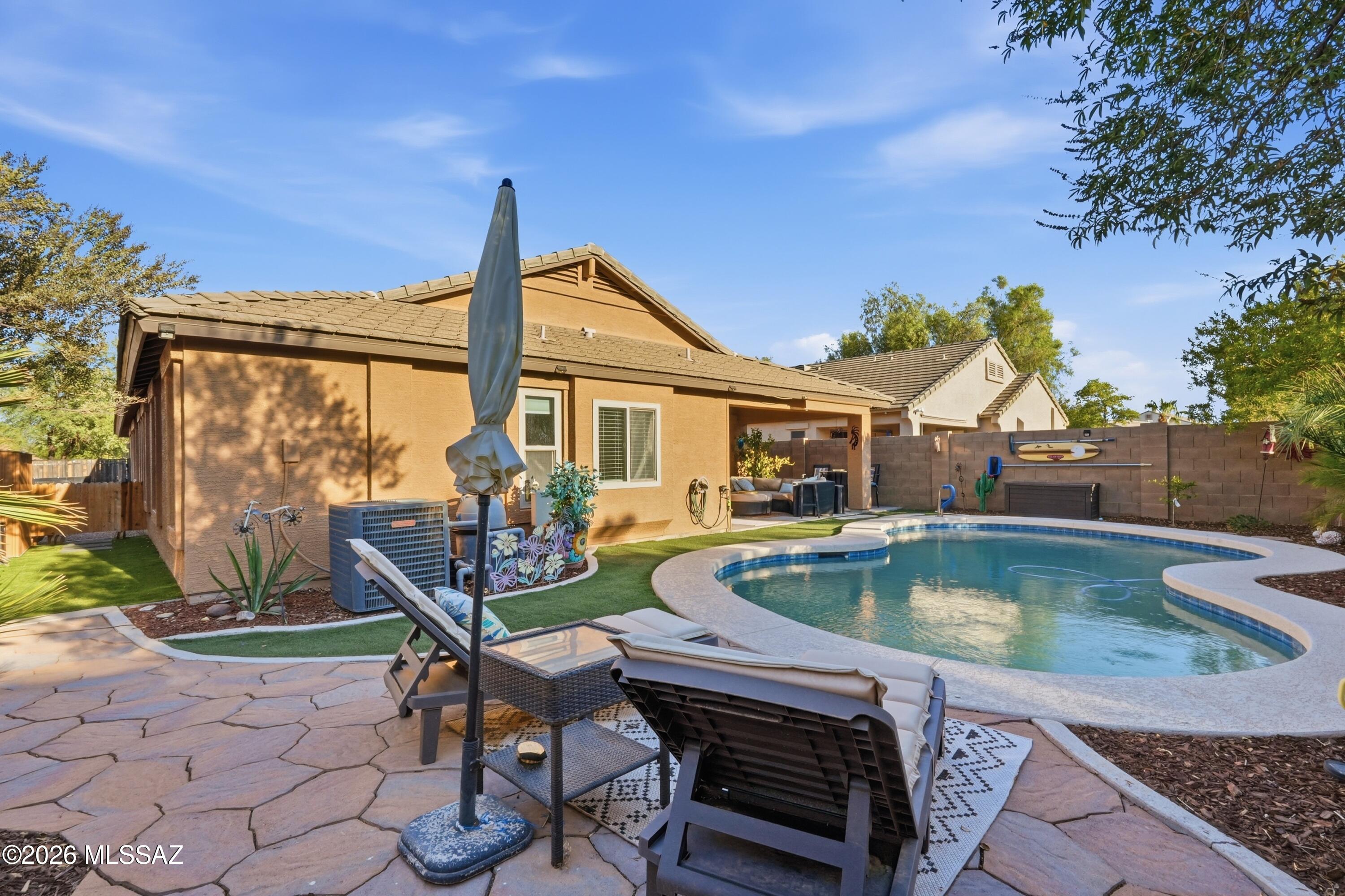 This beautiful ranch style home built by D.R. Horton in 2007 in the popular G Diamond Ranch Community is approximately 2,150 square feet of thoughtfully designed living space await in this well-appointed home nestled in a cul-de-sac with a neighborhood park conveniently located across the street, this home offers a wonderful combination of privacy, convenience, and community. 

Featuring three bedrooms and two bathrooms, this residence offers an abundance of natural light and an open concept layout that seamlessly integrates the living, dining and kitchen areas. The primary bedroom is a tranquil retreat, providing ample space and abundant natural light. The attached bathroom includes dual vanities, creating a spa-like oasis. Two additional bedrooms offer versatility, accommodating a variety of needs. The home's spacious layout is complemented by a neutral color palette and bright lighting. Wood plank tile floors in the dining room add warmth and elegance, while new carpet throughout the home provides comfort and coziness. Stepping outside, the lush landscaping, built-in flower beds, and a well-established desert landscape with mature trees and bushes. An in-ground irrigation system helps maintain the mature, landscaped yard and paver driveway contribute to the home's curb appeal. The expansive backyard features a sparkling pebble tec pool and an inviting patio. The home also boasts recent upgrades, including a new water heater, fresh interior and exterior paint and a 2yr old pebble tec pool finish and pool decking, ensuring a move-in ready experience. The epoxy garage floors, full length workbench, smart garage door opener, and trailer parking further enhance the property's functionality and convenience.