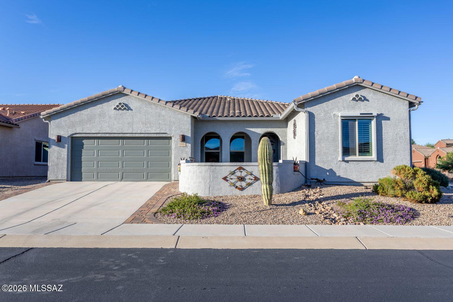 Thoughtfully designed and spacious, this immaculately cared for 2018 built Meritage home has been upgraded inside & out.  The spacious front courtyard, decorative screen doors, high ceilings, gourmet kitchen w/ extra large island with granite countertop, split bedroom floor plan, upgraded lighting, interior colors window coverings, epoxy covered garage floor, and fully landscaped backyard are merely a sample of what awaits you. Pride of ownership is evident throughout this home.  Enjoy the many conveniences and the available activities that living at Canoa Ranch has to offer.