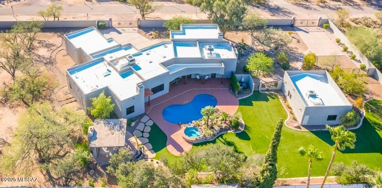 Rare Opportunity in Central Tucson's Treasured, Historic Colonia Solana. Sprawling Estate-Like Compound Featuring Separate Gated Entrances. Completely Walled-In 1.07 Acres of Privacy filled Midtown Living. Completely Rebuilt in 2006 & Lovingly Upgraded by Current Owners. Soft Santa Fe Design Concept w/ 3716 Sq Ft 4-Bedroom Main House  & Charming 723 Sq Ft Guest Casita. Amazing Resort-Like Backyard w/ Pebble Tec Pool/Spa, Entertainment Inspired Ramada, Flagstone Bar & Expansive Turf Areas Including Putting Green. Property is Surrounded by Mature Vegetation & Offers Huge, Undeveloped Area Offering Potential for Further Expansion. Recent Updates Include: New Epoxy Floors at 3-Car. Garage, New Stucco on Both Houses, Newer HVAC, New Interior Paint, Painted Boundary Walls & New Roof Coating.