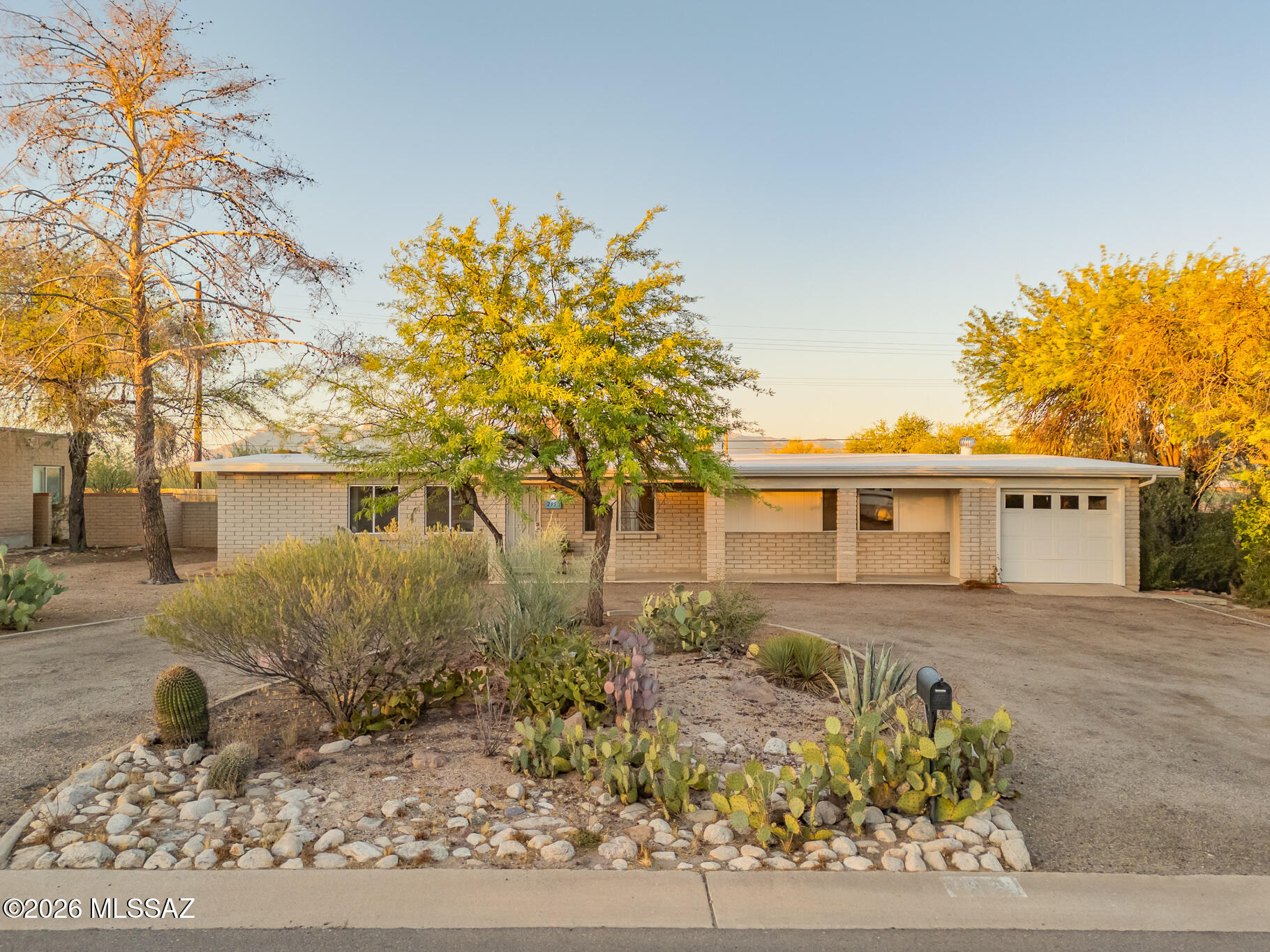 Move-in ready 3-bed, 2-bath home in a desirable west Tucson neighborhood with no HOA. Recent improvements include a new garage door, outlet receptacles, serviced HVAC, coated roof, remodeled interior, and electric-insert beehive fireplace. Features include walk-in closets in every bedroom, a large laundry/mud room, workshop with storage, and a bonus room with separate entrance ideal for a studio, office, workshop, or potential 4th bedroom. On a .3-acre lot with mountain views, the property offers a circular driveway, garage, native landscaping, screened Arizona room, three covered patios, additional covered outdoor space, and separate yard area for RV/additional vehicle parking, dog run, or garden. Near downtown, U of A, PCC, Starr Pass, Tucson Mountain Park, shopping, dining, and schools.