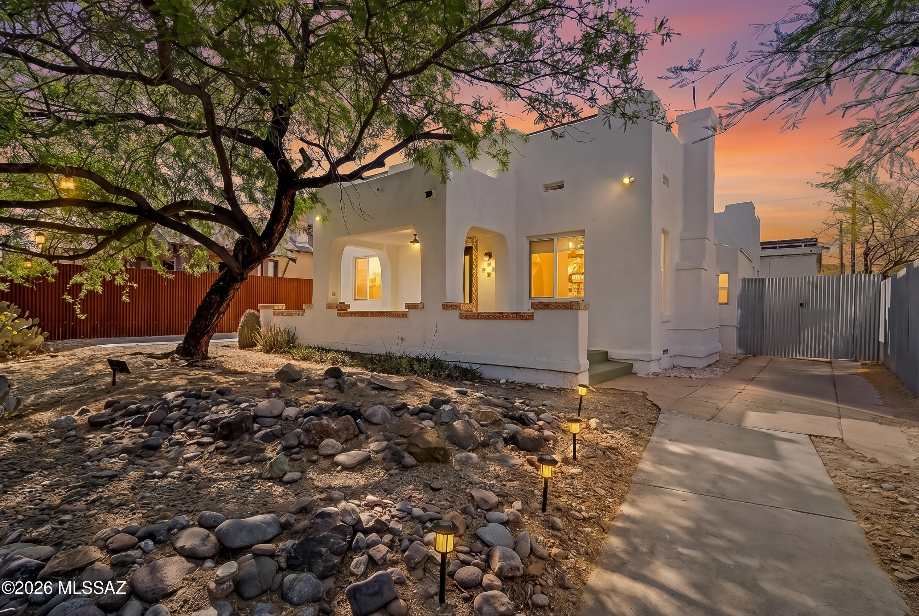 Location, Location, Location. Amazing remodeled home in the heart of the historic University area, directly across from the University of Arizona. Home has been completely updated but still maintains all the original charm and character.  Kitchen features shaker style cabinets, quartz countertops, stainless appliances, induction cooktop, and sit up bar. Kitchen opens to dining area and great room with cozy fireplace making it the perfect layout. Four generously sized bedrooms plus an additional office/den area allow for extra bonus space.  One bedroom functions as an attached ''casita'' with its own kitchenette, bath and separate entrance for added flexibility.  Updated wood and tile flooring throughout, no carpet, new lighting, window coverings, and fully remodeled baths make this home truly move in ready.  Situated on a large lot with covered front patio plus private landscaped rear yard are ideal for enjoying the outdoors.  Fully enclosed yard for added security and parking available in back for 5 cars. You can be on campus in a matter of minutes and close to the Rec Center, Arizona stadium and tons of restaurants, shopping and amenities.  These special homes don't last long.