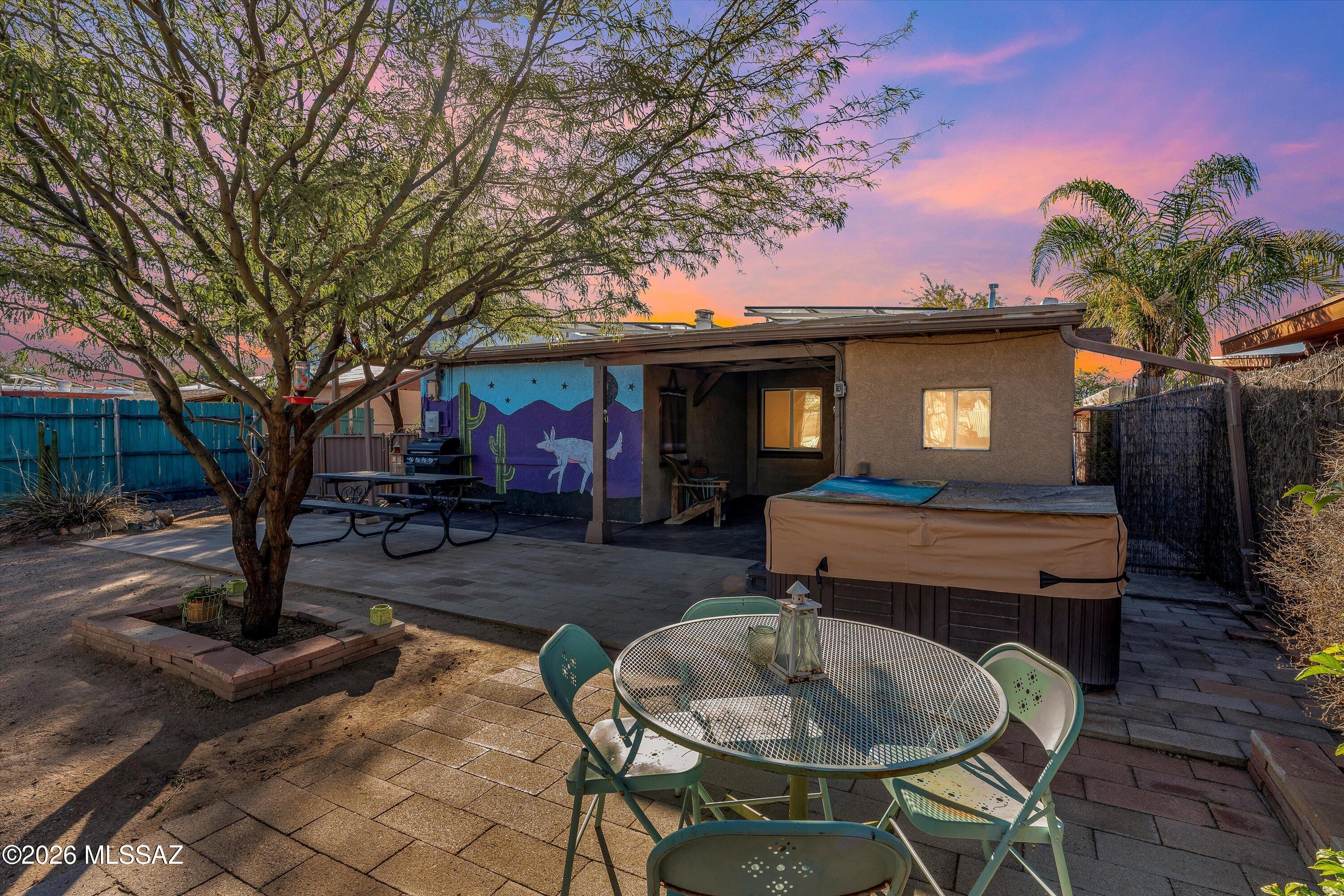 Fully furnished 1939 adobe/block home available for short- or mid-term lease in Tucson's desirable historic Westside. This 2-bedroom, 1-bath residence offers 1,002 square feet of thoughtfully updated living space, blending classic Southwest charm with modern convenience. The home features fresh interior paint, abundant natural light, a cozy wood-burning fireplace, and a unique hand-painted mural that adds character and warmth. An extended laundry room with additional storage and a separate studio/workspace provide ideal flexibility for remote work or creative use. The private backyard with covered patio offers a peaceful outdoor retreat. Conveniently located just minutes from Downtown Tucson, the Mercado District, and MSA Annex, with close proximity to St. Mary's Hospital and Banner Banner University Medical Center Tucson, making it ideal for traveling nurses, medical professionals, and business travelers. Walkable to local cafes, restaurants, and shops, and just 10 minutes to the University of Arizona. Flexible lease terms available; fully furnished and move-in ready.