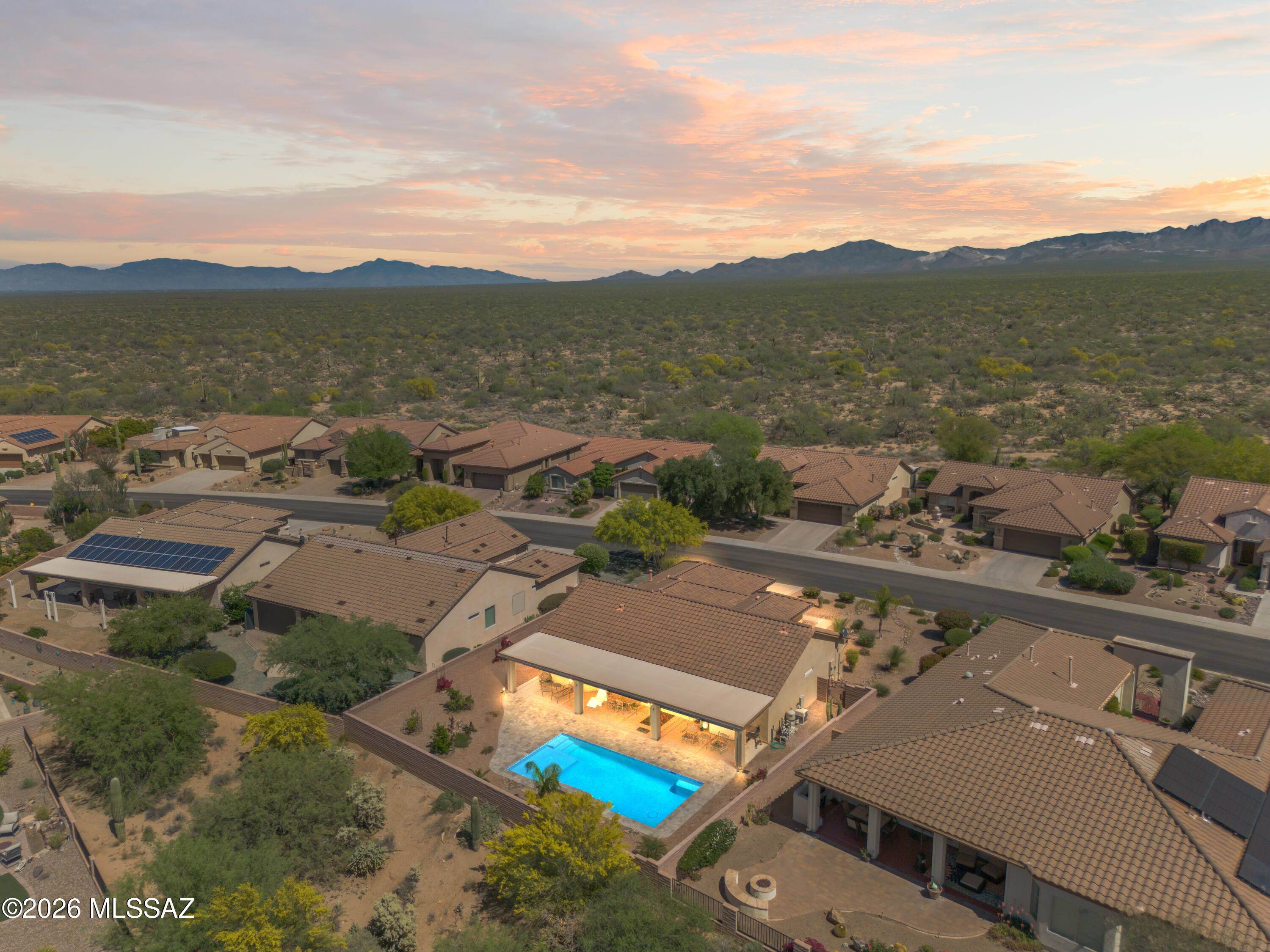 Whether you're looking for a full-time residence, or lock-and-leave Arizona getaway, this property has you covered! This sought-after Laredo model is move-in ready and loaded with upgrades. Enjoy a sparkling new heated pool in a spacious backyard backing to a wash for exceptional privacy. The low-maintenance pool features an in-floor cleaning system and solar blanket, all surrounded by elegant travertine decking. Inside, the chef's kitchen boasts 42'' mahogany cabinetry, granite countertops, custom backsplash, stainless steel appliances, gas stove, pantry, and generous dining space. Plantation shutters throughout, updated bathrooms, a versatile den, and a split-bedroom floor plan complete the home. Offered fully furnished, simply unpack and start enjoying the Quail Creek Lifestyle!