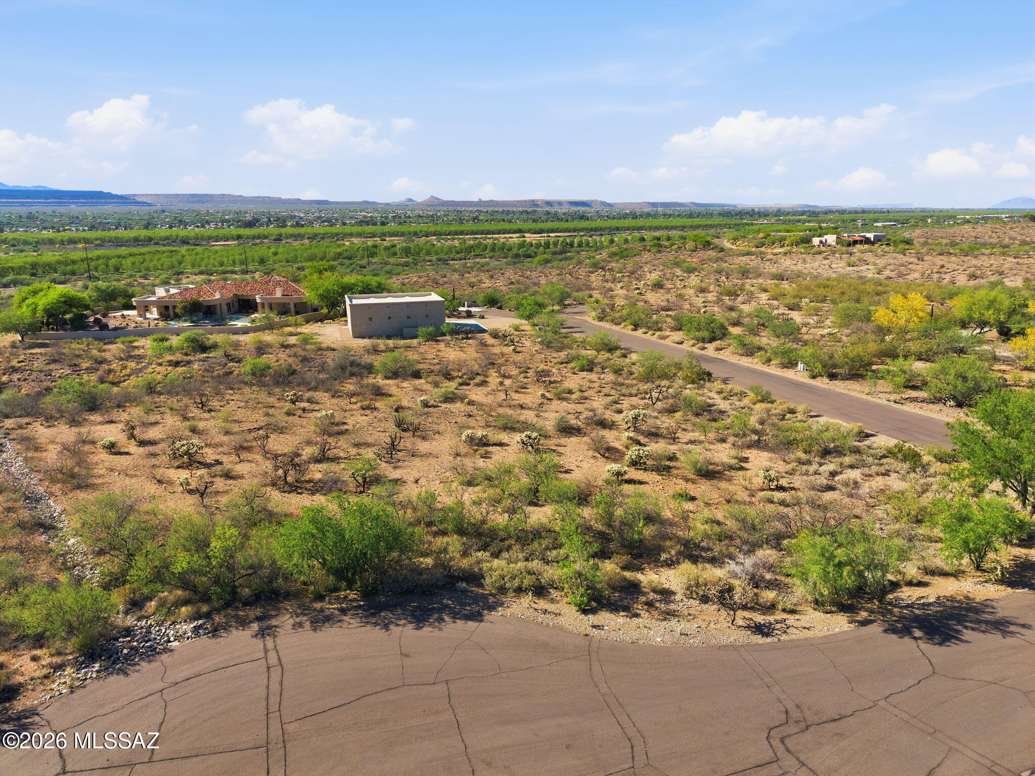 Nestled within the prestigious gated community of Madera Foothills Estates, Lot 10 presents a rare opportunity to build your dream home in a setting that feels both private and expansive. Spanning 1.44 acres, this thoughtfully positioned homesite offers sweeping panoramic views, with the Santa Rita Mountains providing a stunning natural backdrop. With just the right amount of space to design your ideal layout, you can orient your home to capture the beauty of the desert landscape--morning light, evening colors, and everything in between. It's a place where the horizon feels endless and the pace of life slows down. Utilities are already available at the property, including gas, electric, and water provided by Global Water Resources--no well required--making your building process more straightforward. A septic system will need to be installed by the buyer. Optional GVR membership is also available, offering access to a variety of recreational amenities.

This is more than just land--it's an opportunity to create something lasting. Build your vision, your lifestyle, and your future right here.