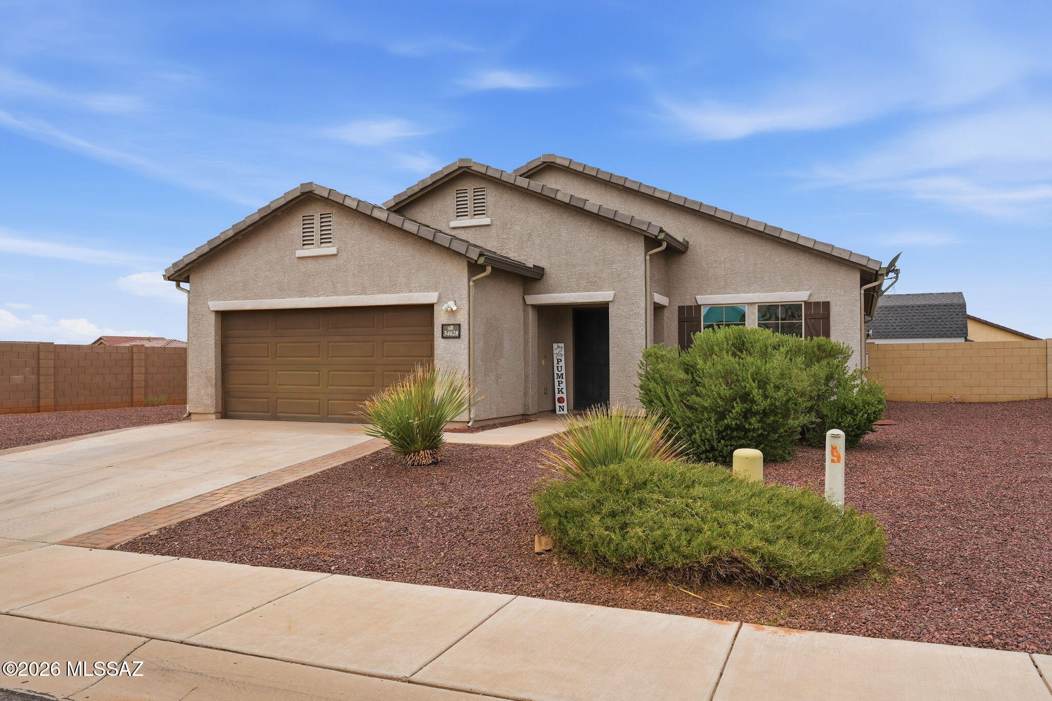 Welcome home to this beautiful property in family friendly Red Rock community! New Interior Paint and New Carpet! Offering 1,895 sq ft with 3 bedrooms, 2 bathrooms, a versatile den, and a 2.5  tandem garage. The spacious great-room floor plan is perfect for entertaining, with an inviting kitchen and large island that keeps everyone connected. Situated on a large corner lot with plenty of room to enjoy the Arizona lifestyle. Out back, a large shed is ready to become the ultimate she shed, he shed, workshop, hobby space, or extra storage--you decide! Conveniently located near schools with easy access to I-10, this home offers the space, functionality, and location you've been looking for!