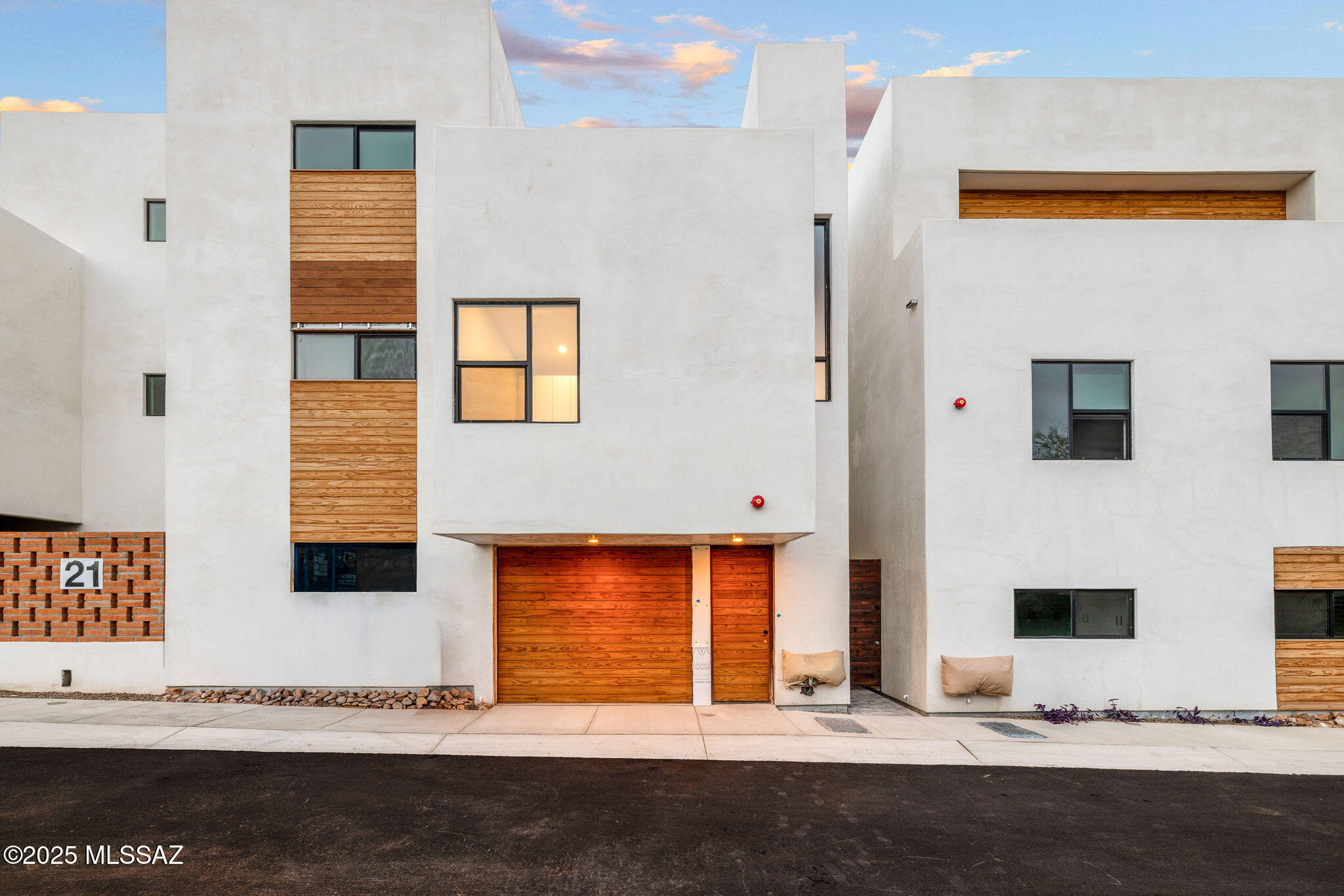 Welcome to the epitome of upscale urban living in Tucson's vibrant Five Points neighborhood, where modern sophistication meets historic charm. This is The Row at 18 W. 18th, an exclusive 16-unit desert contemporary townhome subdivision featuring a harmonious blend of luxury & location, boasting solid white, smooth stucco construction with authentic adobe brick accent walls. Meticulously designed by HA|RU architects, in collaboration with Durazo Construction, honors the ethos of Southern Arizona with clean lines and a contemporary feel that maximizes natural light, creating an open, and airy ambiance throughout each home. The kitchens are designed for style and functionality, complemented by custom Davis Kitchen cabinetry that embody superior craftsmanship and luxurious design. The primary bedrooms offer en-suite baths with custom closets by Classy Closets, offering ample storage solutions. These thoughtfully designed spaces are perfect for the discerning homeowner who values quality and attention to detail, captured throughout each space. Located in the heart of vibrant Five Points, where 5 historic and distinct neighborhoods meet, these townhomes offer unrivaled walkability and access to a plethora of amenities and authentic, local restaurants. Residents will enjoy a dynamic lifestyle with everything at their doorstep from artisan coffee shops to organic grocers, eclectic dining, and vibrant community events, all with a Walk Score of 84 and a Bike Score of 98. This is more than a home; it is a lifestyle rooted in convenience, culture, and modern luxury, seamlessly blending with the historical beauty of Tucson. Embrace the opportunity to live in a place where contemporary design and historic charm coexist in perfect harmony.DON'T MISS THE SPECIAL BUILDER INCENTIVES THAT MAY BE AVAILABLE FOR QUALIFIED BUYERS, CONTACT US TODAY FOR CURRENT DETAILS!