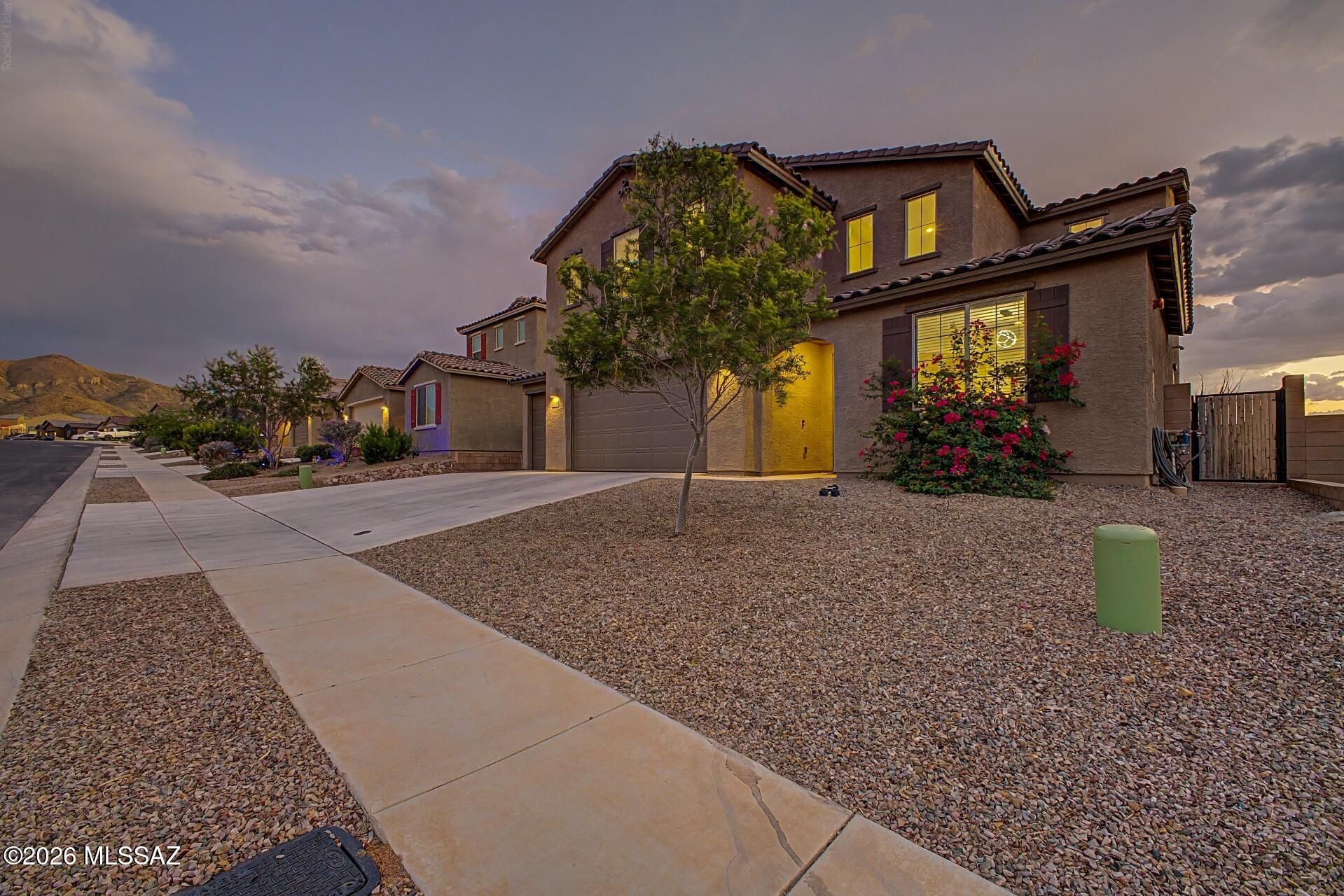List Range Pricing, $449,900 - $464,900 *** Privacy, space & stunning sunsets! This impressive 3BD/3BA home with den & loft features huge bedrooms, walk-in closets and a decorative iron banister. The spacious kitchen offers an oversized island, 42'' cabinets, double pantry plus dry pantry/bonus room for added storage and flexibility. The primary suite features an oversized walk-in shower. Enjoy incredible sunset views with no front or rear neighbors for added privacy! The landscaped backyard is perfect for relaxing or entertaining with pavers, firepit, artificial turf, dog run, 4 fruit trees & beautiful Chinese elms. Spacious living areas, thoughtful upgrades and flexible spaces make this home perfect for everyday living, working from home and entertaining. Also an over sized 4 car garage!