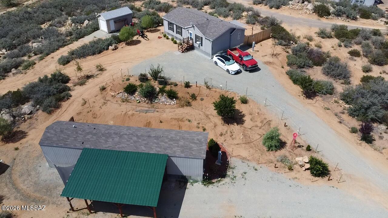 Escape to Northern Arizona and enjoy cooler temperatures on 3.37 usable acres at the end of a quiet dead-end street. This unique property features two 2023 manufactured homes ideal for multigenerational living, rental income or guest accommodations. The main home offers 3 bedrooms and 2 baths, while the second home includes 2 bedrooms and 1 bath. Both feature luxury vinyl flooring, dual-pane windows, faux wood blinds and included appliances. The property also offers a private well, full drip irrigation system, established fruit trees, roses, junipers and a 10x20 shed with roll-up door. Bring your horses, RVs, and toys with no HOA! Own two homes Up North for the price of one! Conveniently located between Phoenix and Prescott for ease of convenience!