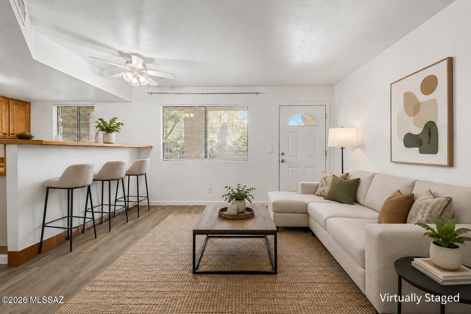 Welcome to this charming 2-bedroom, 1-bath condo offering comfortable, easy-care living in a gated community. Step inside to a bright and inviting floor plan featuring LVP flooring throughout and a kitchen that flows seamlessly into the living area. Both bedrooms offer comfortable space and storage, while one of the home's best features is its view overlooking the community pool, adding a relaxed feel right outside your door. Enjoy the convenience of nearby on-site laundry, while the HOA covers water, garbage, exterior maintenance, and common areas. Centrally located with easy access to Oracle Rd., shopping, dining, schools, and everyday conveniences. Cozy, convenient, and full of potential--come see all this condo has to offer!