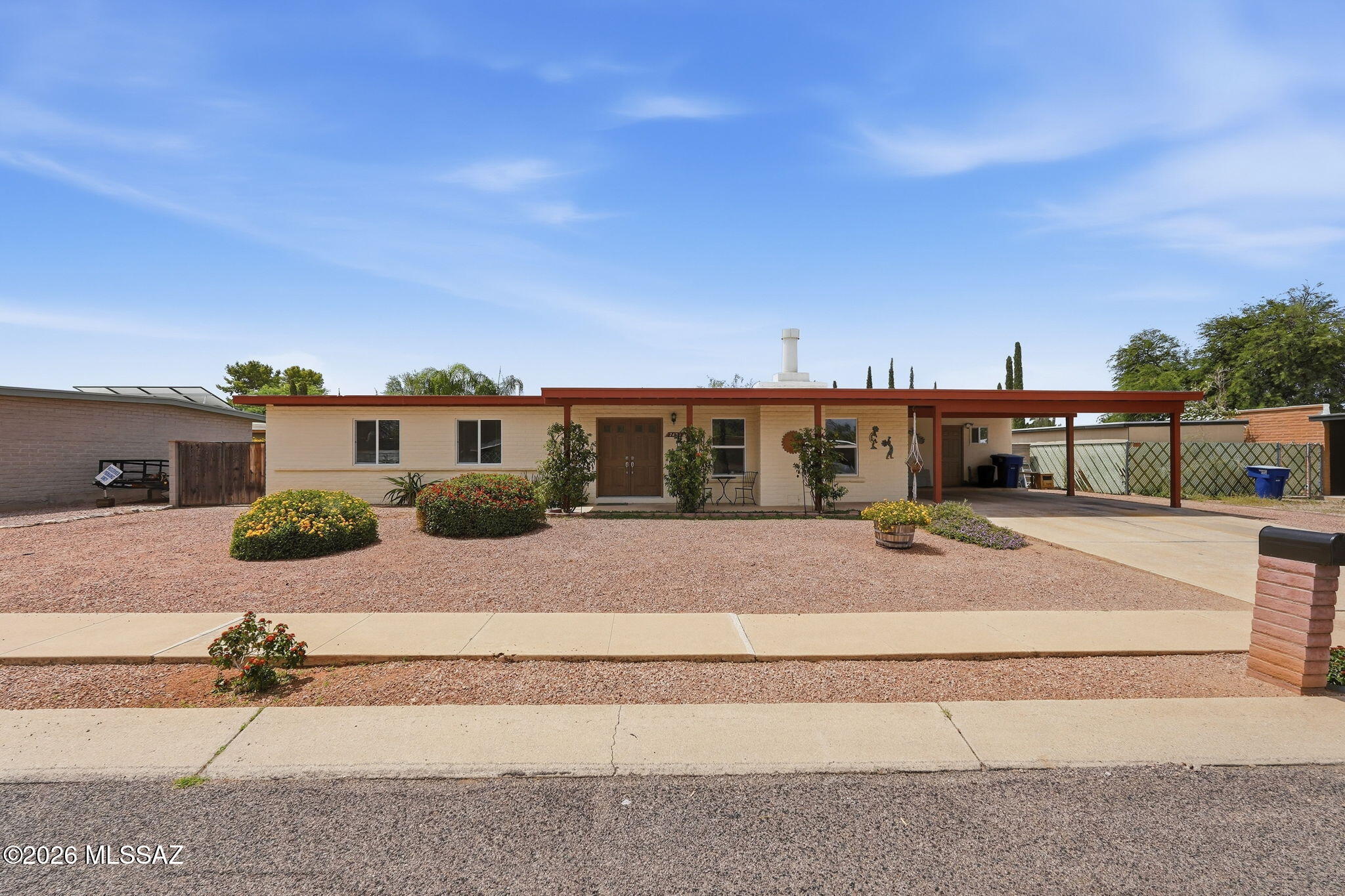 Charming and well maintained Ranch Style home with 3 bedrooms and 2 baths located in the East Tucson area. Home features: 1,781 square feet of living space, double front doors, spacious kitchen with plenty of cabinets and center island, recessed lighting, walk-in pantry and dining area. Ample sized laundry room with washer and dryer included. Wood burning fire place located in Living Room. LPV and ceramic flooring. Double pane windows. Ceiling fans throughout. Large fenced backyard with fountain and small pond and a shed. Covered patio with built-in barbecue and spa.  Spacious primary bedroom.  Two car carport and RV space available. NO HOA.