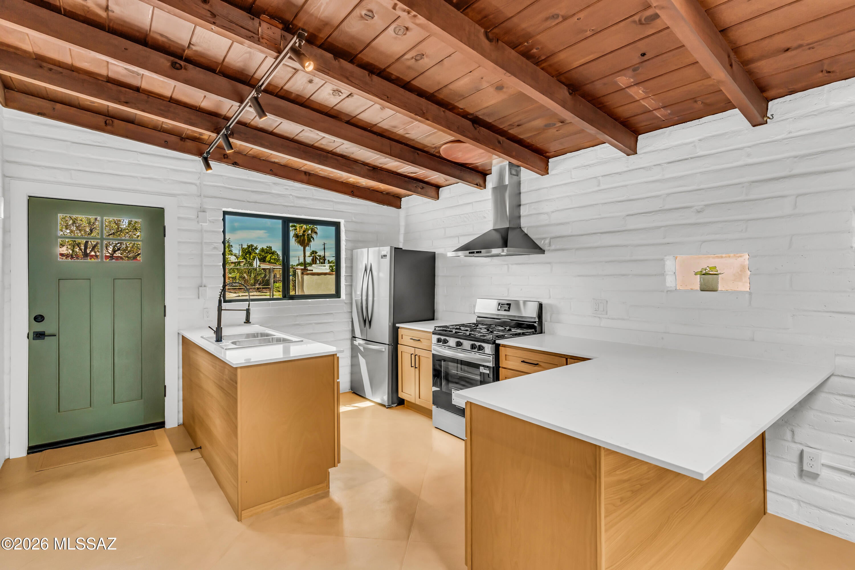 This one has style. A thoughtfully updated mid-century home with exposed beams, polished concrete floors, warm brick, and clean modern finishes that give it a distinctly Tucson feel. The kitchen and bathroom have both been refreshed, while new windows, a new water heater, and a new HVAC system bring the practical updates too. It's been completely renovated and updated. Outside, the oversized lot gives you plenty of room to spread out, entertain, garden, or create your own desert oasis. It's compact, cool, full of character, and completely move-in ready. If you've been looking for something with more personality than the typical remodel, this is it. Owner/Agent
