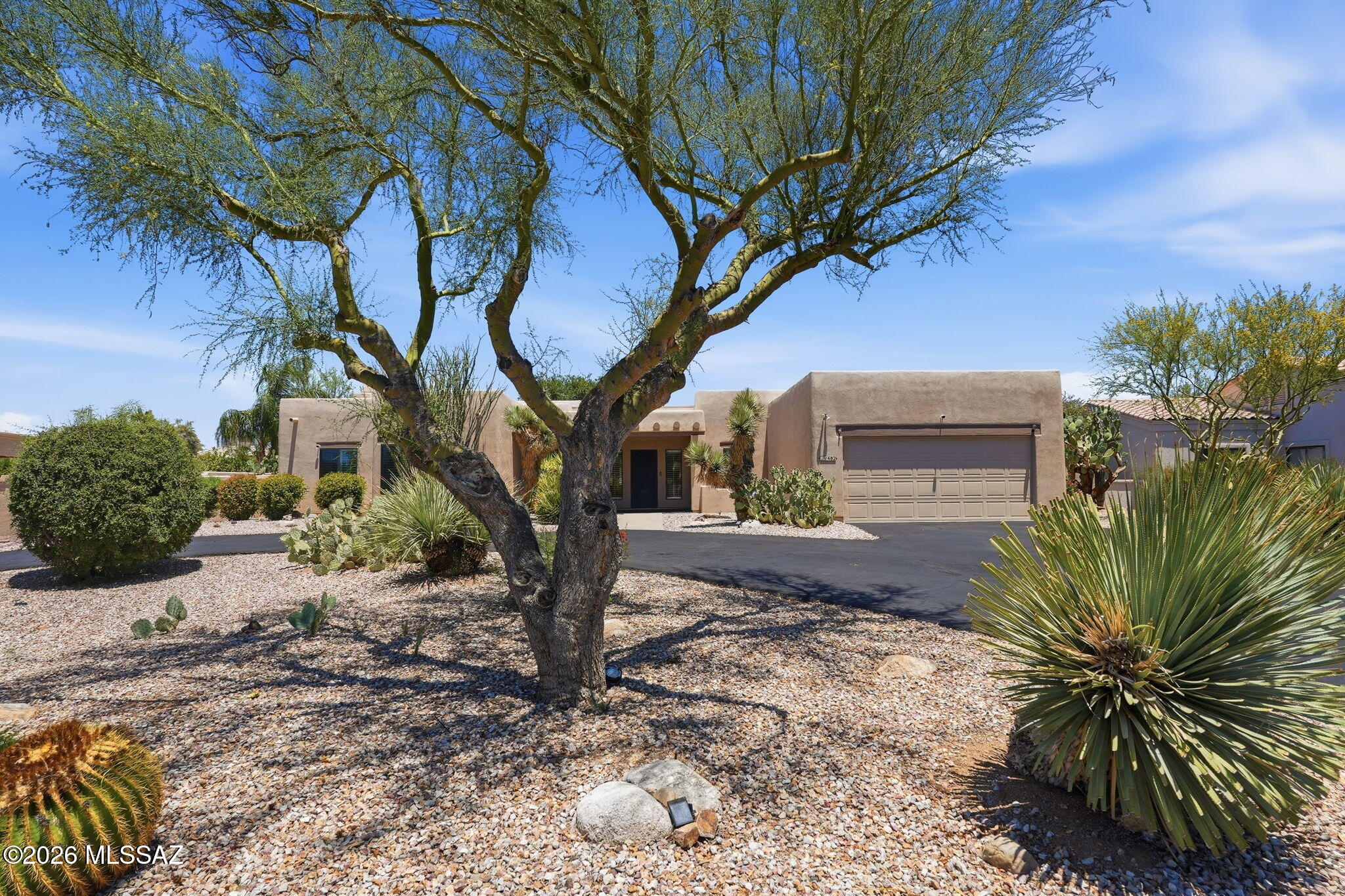 Located in the desirable Desert Vista Estates in Oro Valley. This meticulously maintained semi-custom home sits on over .37-acre cul-de-sac lot with a circular driveway & stunning Catalina Mountain views. The split-bedroom floor plan offers abundant natural light, plantation shutters throughout, and no carpet. The spacious kitchen features granite countertops, newer stainless steel appliances and opens to an inviting family room with a cozy gas fireplace. Enjoy outdoor living with a Pebble Tec heated pool & spa, complete with Pentair Screen Logic remote automation system & new heater with variable speed motor. The roomy garage offers abundant storage space. Recent updates include interior paint, water heater, and a sealed and painted roof. Move-in ready and well cared for!