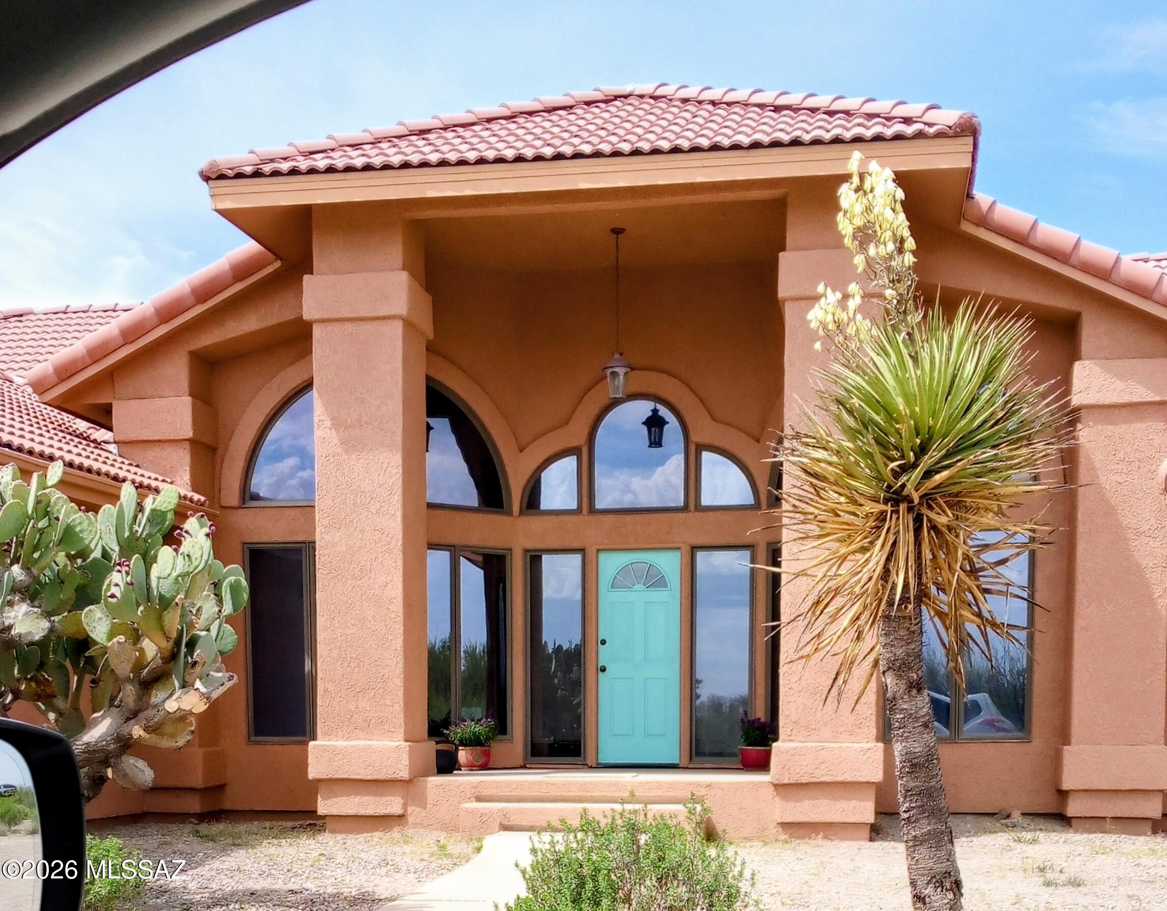 Beautiful 4bd, 2bth, custom home with a lovely, large screened-in porch, attached 2-car garage, detached 1-car garage with a 1/2 bath & workshop area. Horse corral with shelter on 40 acres of pasture land with beautiful mountain views! The formal living room & dining room in the front, lends itself to entertaining your guests. Large windows and skylights provide beautiful natural light. The family room opening up to the kitchen has a cozy gas fireplace. The breakfast area leads out to the enclosed screen porch. French doors in the family room also lead to the screened in porch. The view of the sunsets from this home are truly spectacular! Dark night skies from this property make for magnificent stargazing. Enjoy peaceful privacy and abundant wildlife. All of this can be yours!