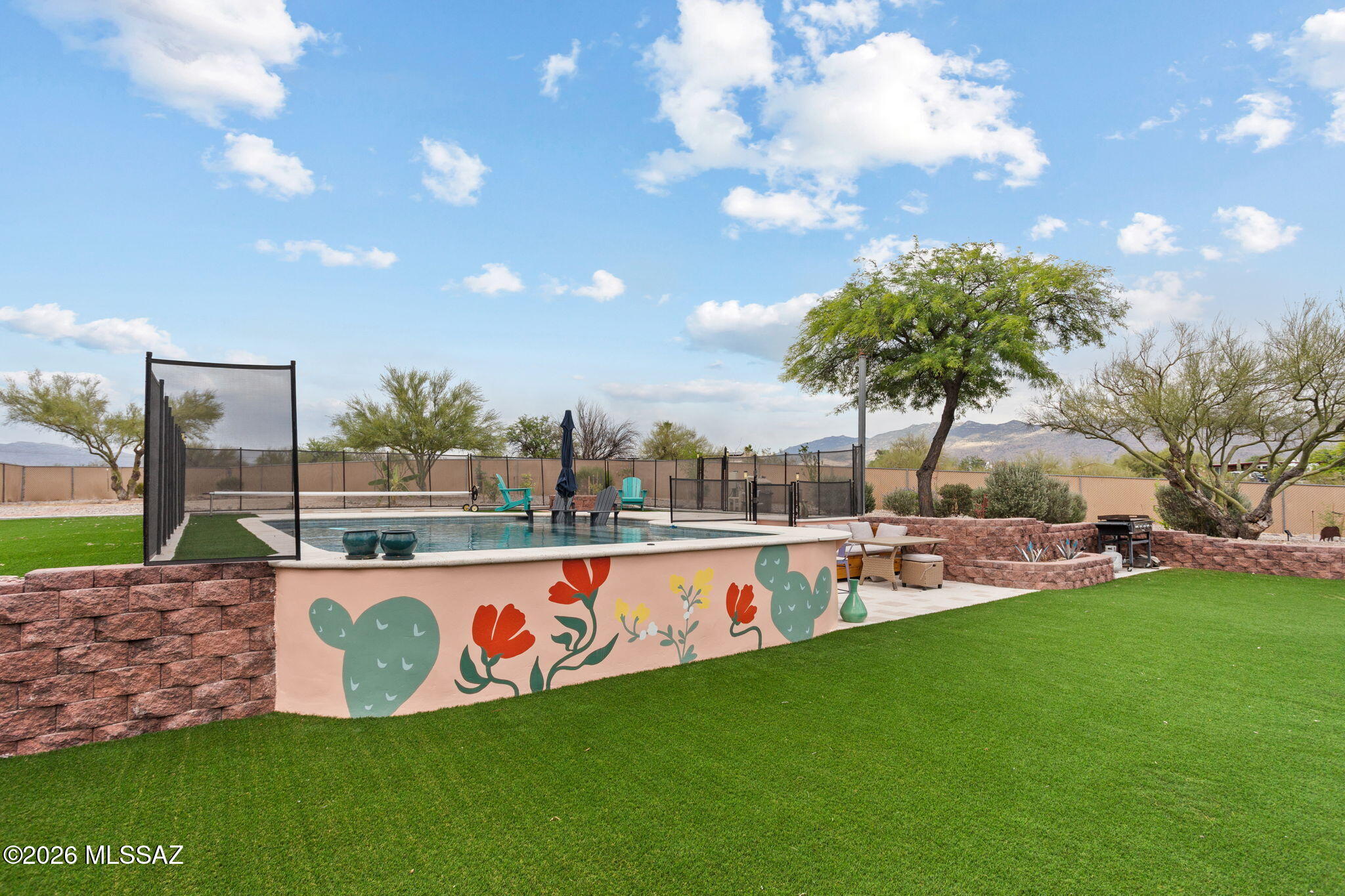 Welcome to this beautifully updated Eastside Tucson retreat on a generous 0.91-acre lot situated at the end of a cul de sac with breathtaking mountain views! This 3-bed, 2-bath home features a bright living room and separate family room/Den. Enjoy brand new carpet, quartz countertops, and a new roof (2026). The private backyard is an entertainer's paradise or perfect for a family to enjoy, with a saltwater pool (2021), covered patio, nearly 3,000 sq ft turf area, and outdoor kitchen hook-ups of power, water and dry well drain. RV 30amp electrical hook-up included. Owned 9.9kw solar system (2019), new HVAC (2024), water heater (2024), full home filtration system and water softener (2021) keep costs low year-round. This move-in ready gem is the total package!