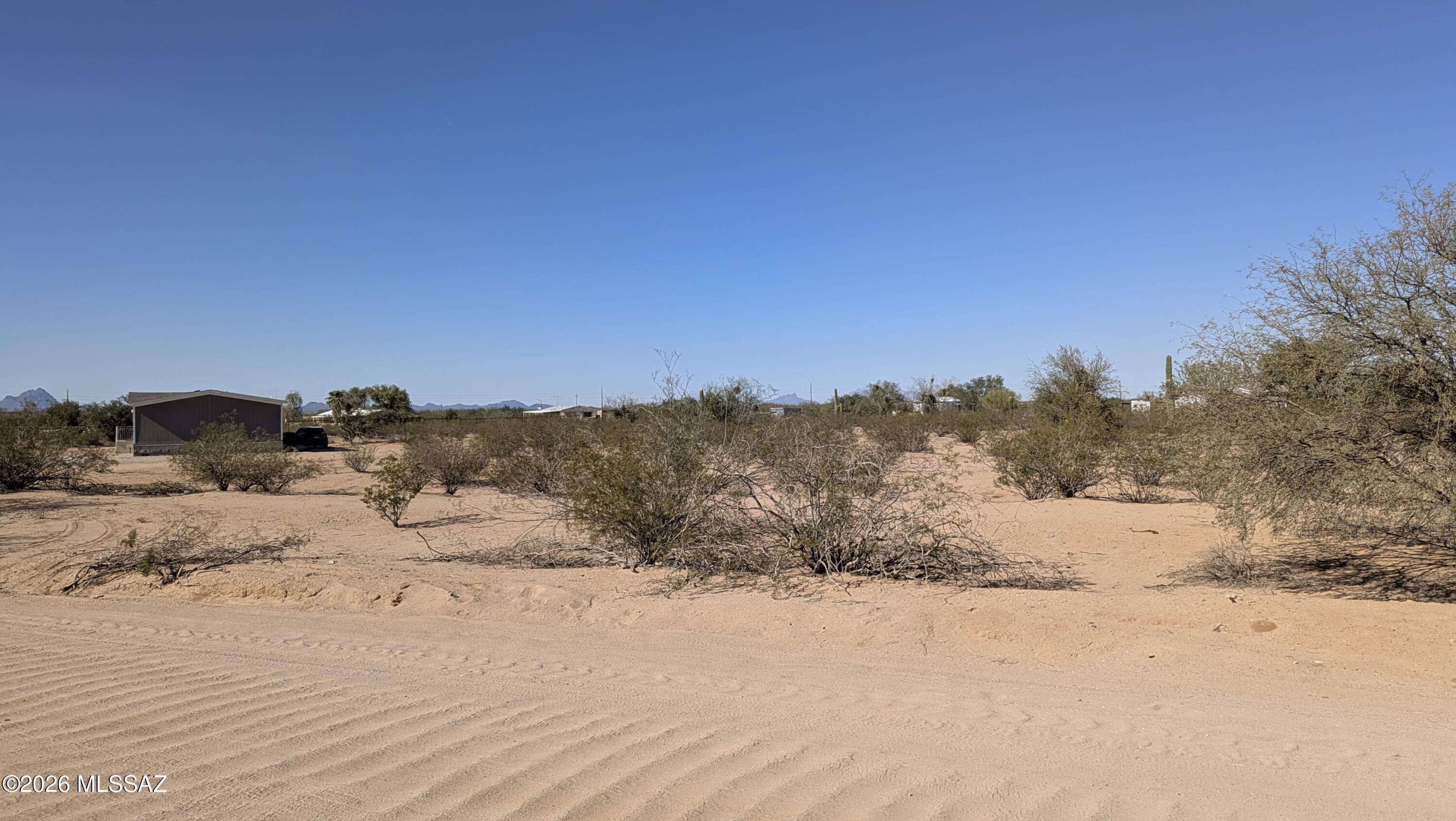 Great opportunity to own an affordable one-acre desert lot tucked away in a quiet, peaceful setting. This hidden little spot offers natural desert landscaping, open skies, mountain views, and plenty of room to create your own Arizona retreat.

Water and electricity are available at the lot line, with water through a shared well. The property offers flexibility for either a manufactured home or site-built home, making it a great option for someone looking for space, privacy, and room to make it their own.

Enjoy the quiet dirt roads, wide-open feel, and natural desert surroundings while still having nearby homes in the area. A great place for anyone looking for affordable land with potential.

Seller financing available. Seller will carry. Adjacent lot also for sale.