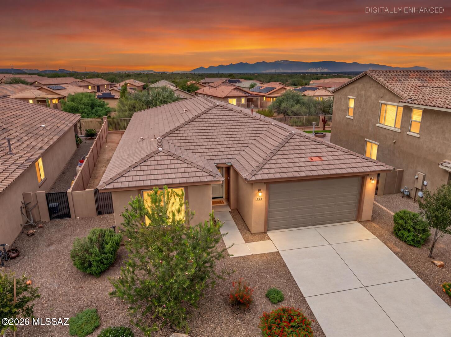 Welcome home to this beautiful, nearly new, spacious single-story home offering 4 bedrooms, 3 full bathrooms, and a 2-car garage! Built just three years ago, this home features a bright, open floor plan with an abundance of natural light, neutral wood-look flooring, warm cabinetry, and gorgeous white quartz countertops throughout. The impressive kitchen is the heart of the home, featuring an oversized island, stainless steel appliances, a dedicated coffee nook, and a large walk-in pantry. The thoughtfully designed floor plan includes three bedrooms with walk-in closets and a spacious laundry room complete with ample cabinetry and a utility sink. Step outside to an extended covered patio overlooking desert views, no rear neighbors, and endless possibilities to create your dream outdoor retreat! Ideally located in a desirable community near shopping, dining, and everyday conveniences, just down the street from the community pool and Safari Park. This move-in-ready home offers the perfect combination of space, style, and modern comfort!