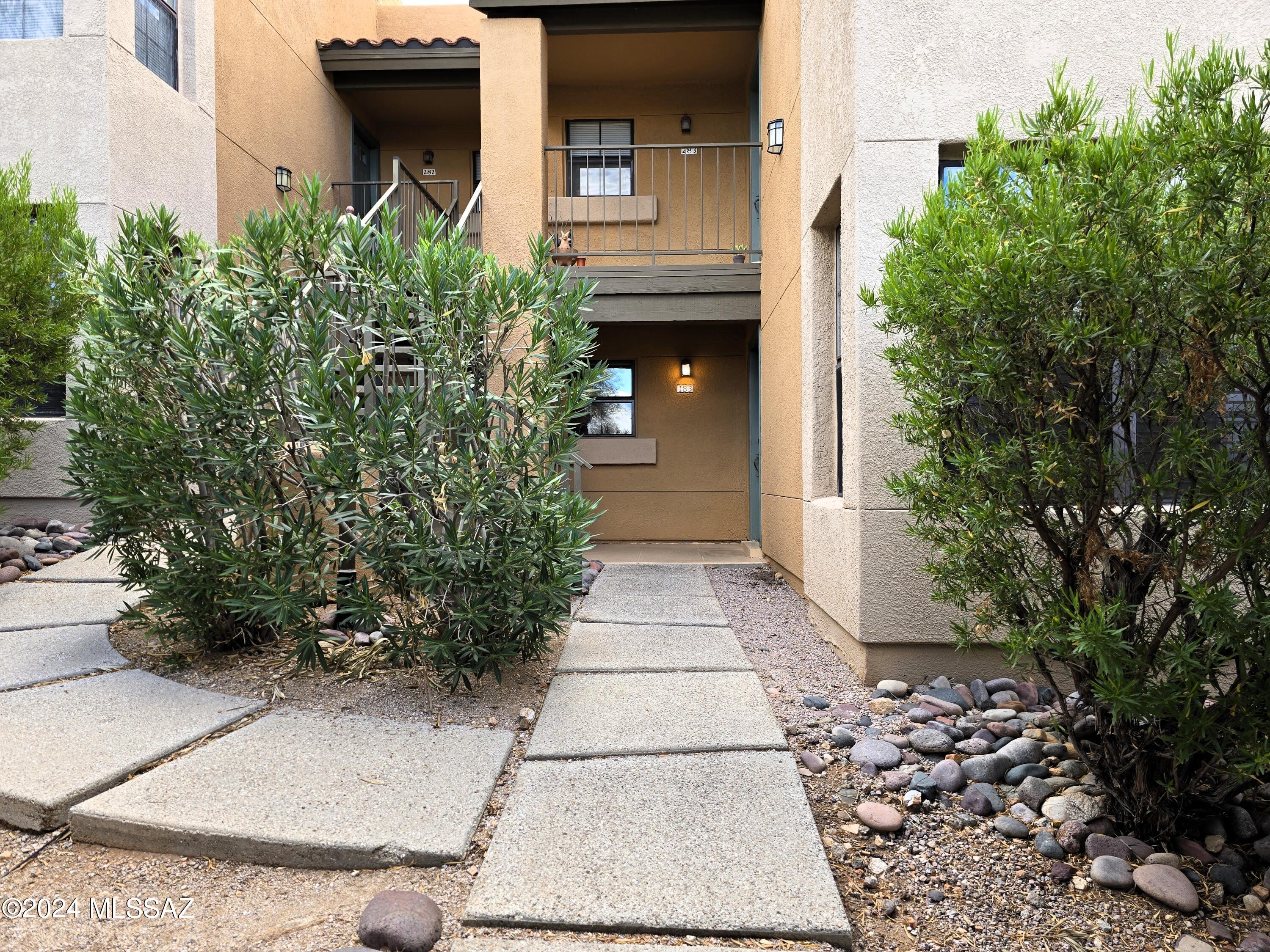 Adorable rental Located in the prestigious Catalina Foothills. This beautiful bottom-unit condo offers 1,076 square feet of living space with two bedrooms and two bathrooms. No carpet here! Tile and stamped concrete floors throughout. Updated kitchen and bathrooms, and wood-burning fireplace. This home offers a luxurious lifestyle with breathtaking mountain views from the extended patio and community amenities, including a pool, spa, gym, & tennis court. All this is located just a short distance from La Encantada's fine dining and upscale shopping. Don't miss out on this home!  Pets on approval with additional deposit.